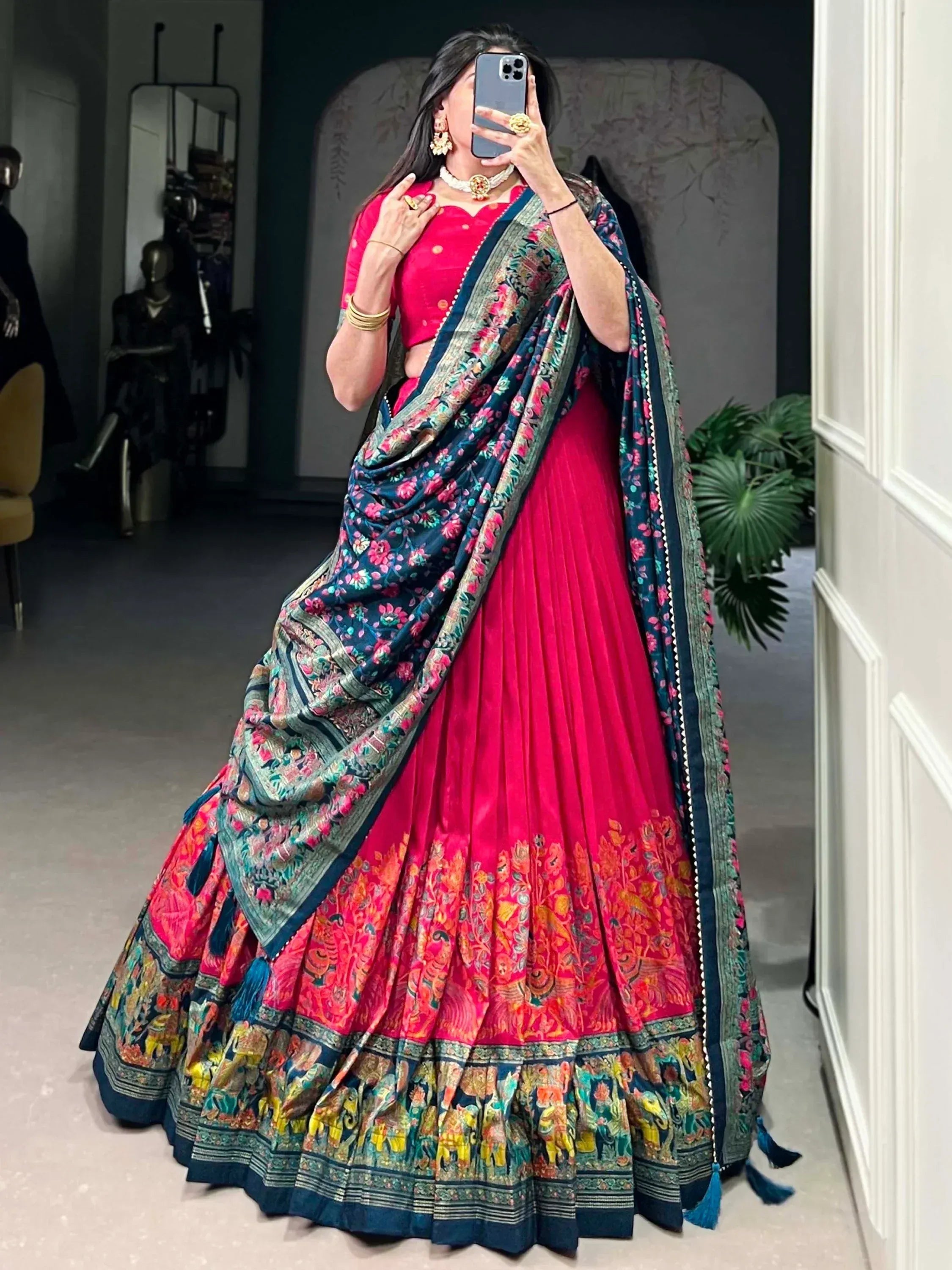 Vibrant pink lehenga choli with floral dupatta, ethnic Indian wear for weddings and festivals