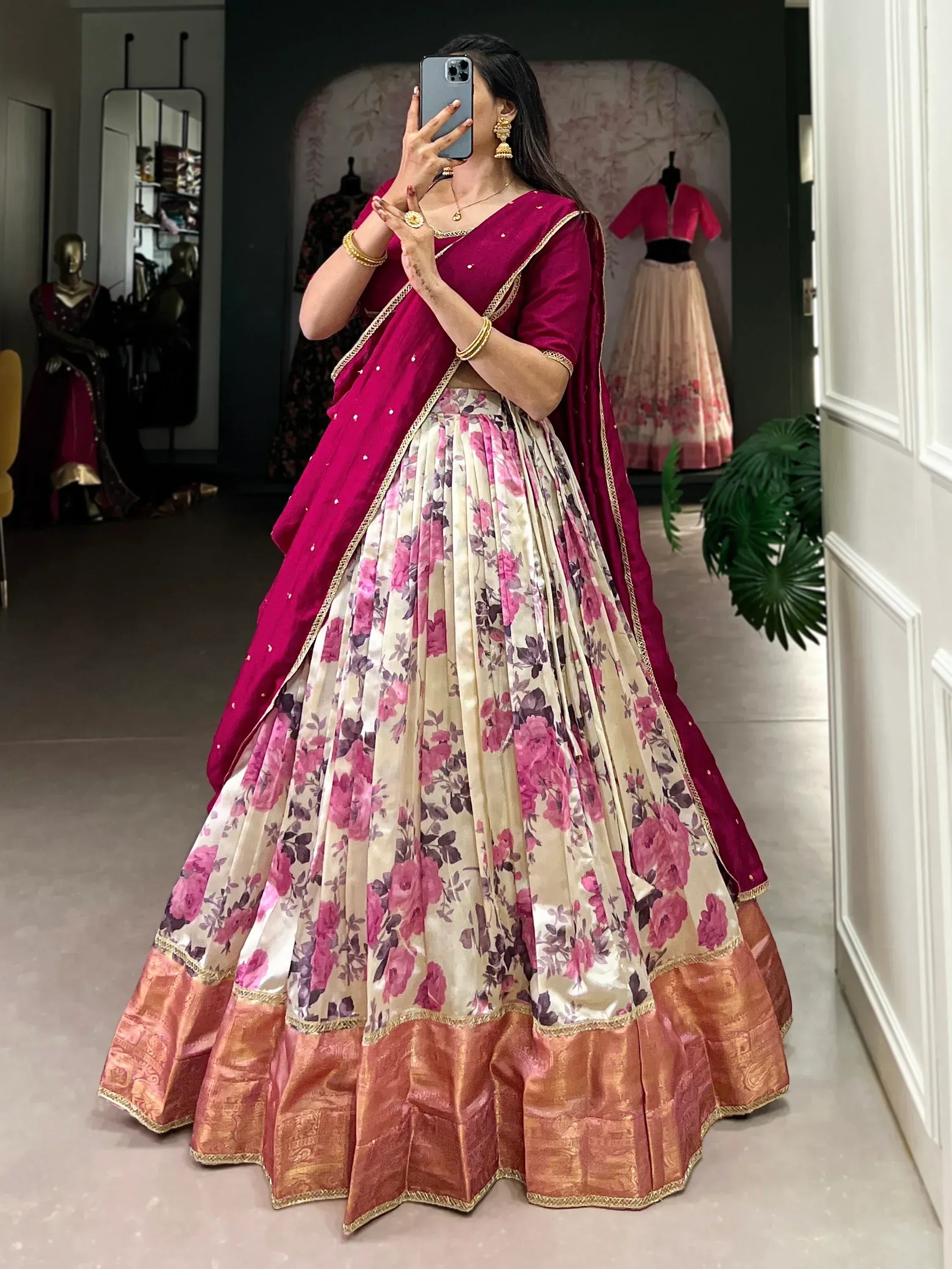 Woman in floral lehenga choli with maroon dupatta, Indian ethnic wear for weddings and festivals
