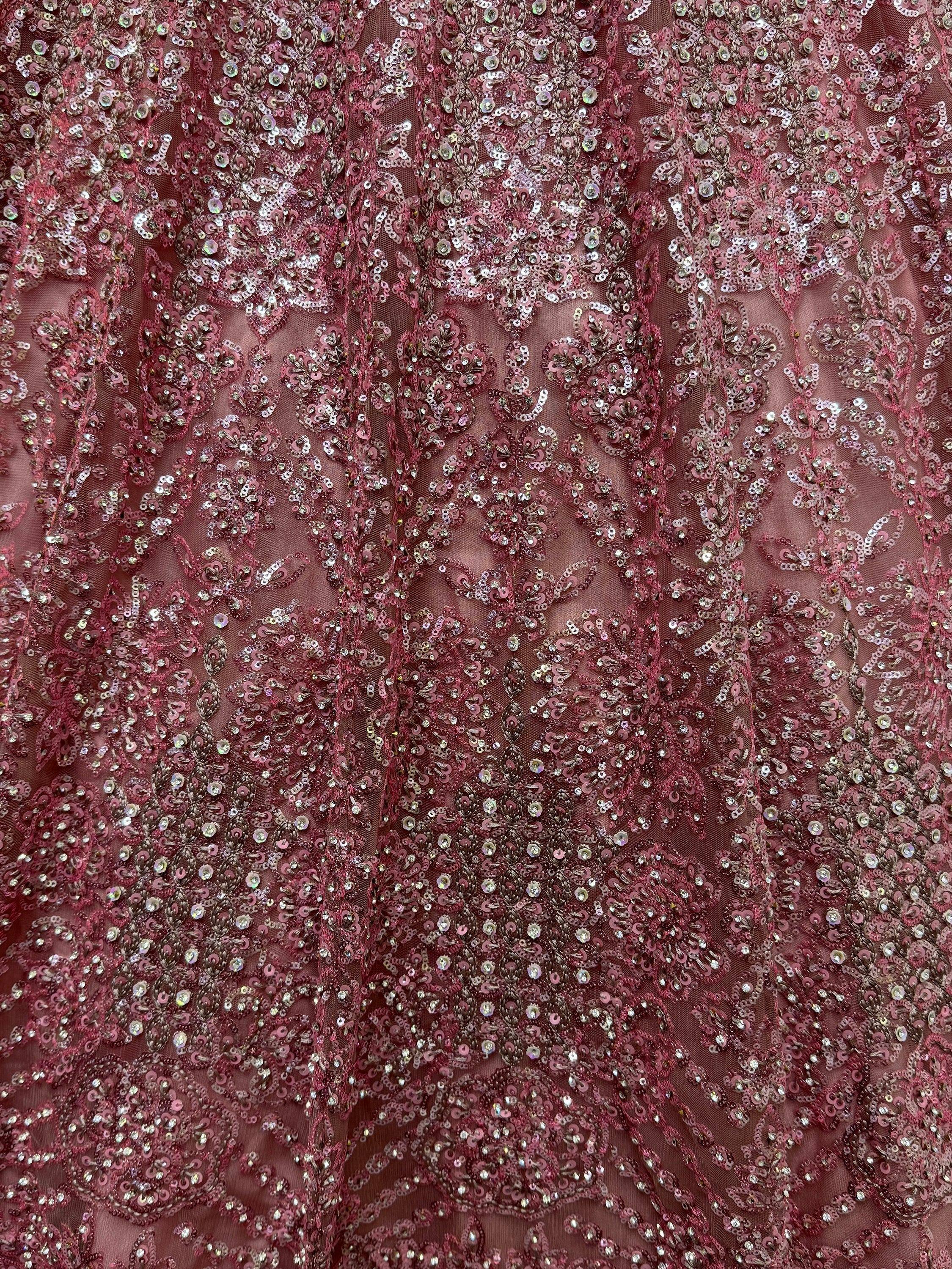 Dusty rose sequin-embellished ethnic wear fabric with intricate floral patterns for designer lehenga or gown