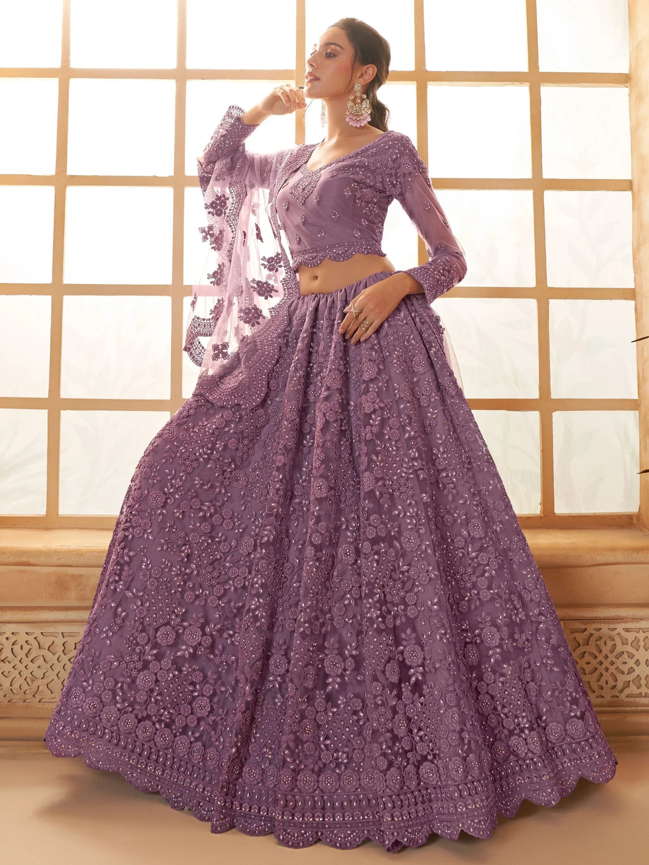 Purple embroidered lehenga choli with floral detailing, perfect for Indian ethnic wear events.