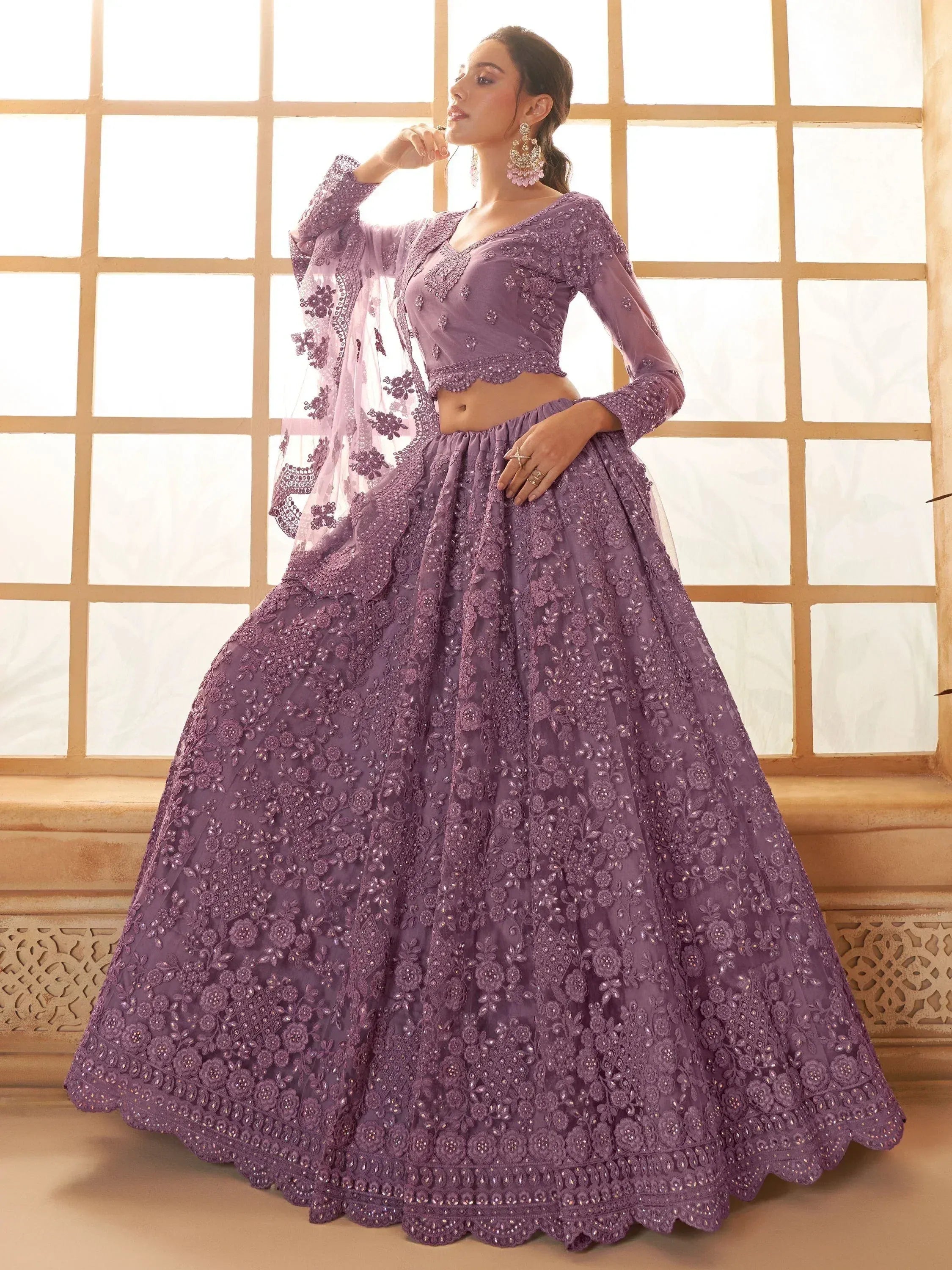 Purple embroidered lehenga choli with floral detailing, perfect for Indian ethnic wear events.