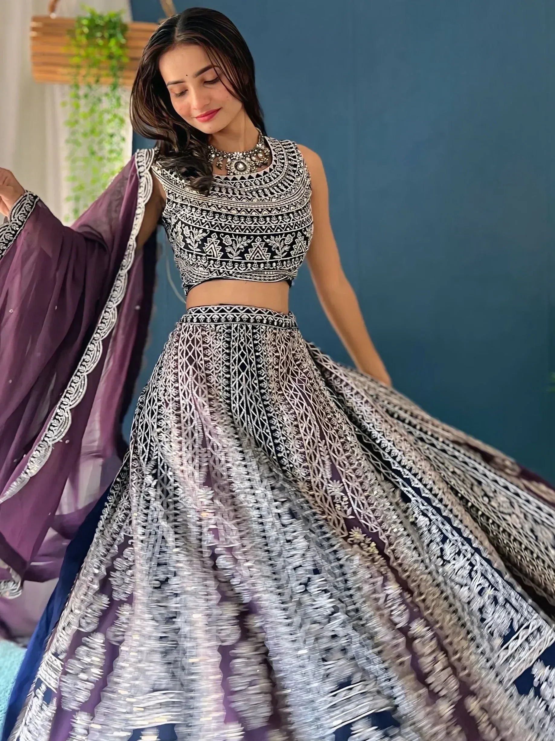 Elegant black and silver embroidered lehenga choli with purple dupatta, perfect for Indian ethnic wear occasions.