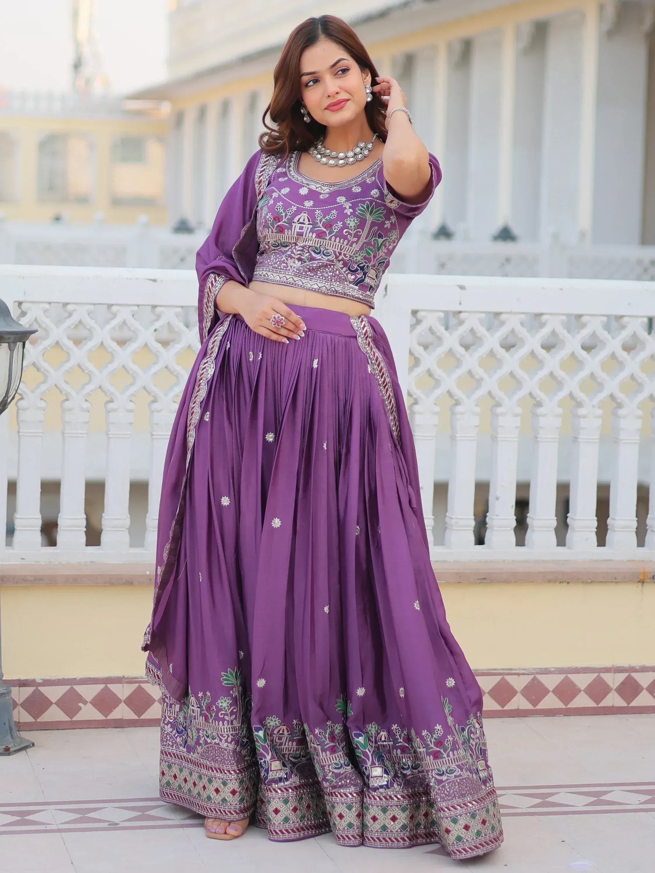 Purple embroidered lehenga choli with floral motifs, perfect for Indian ethnic wear occasions