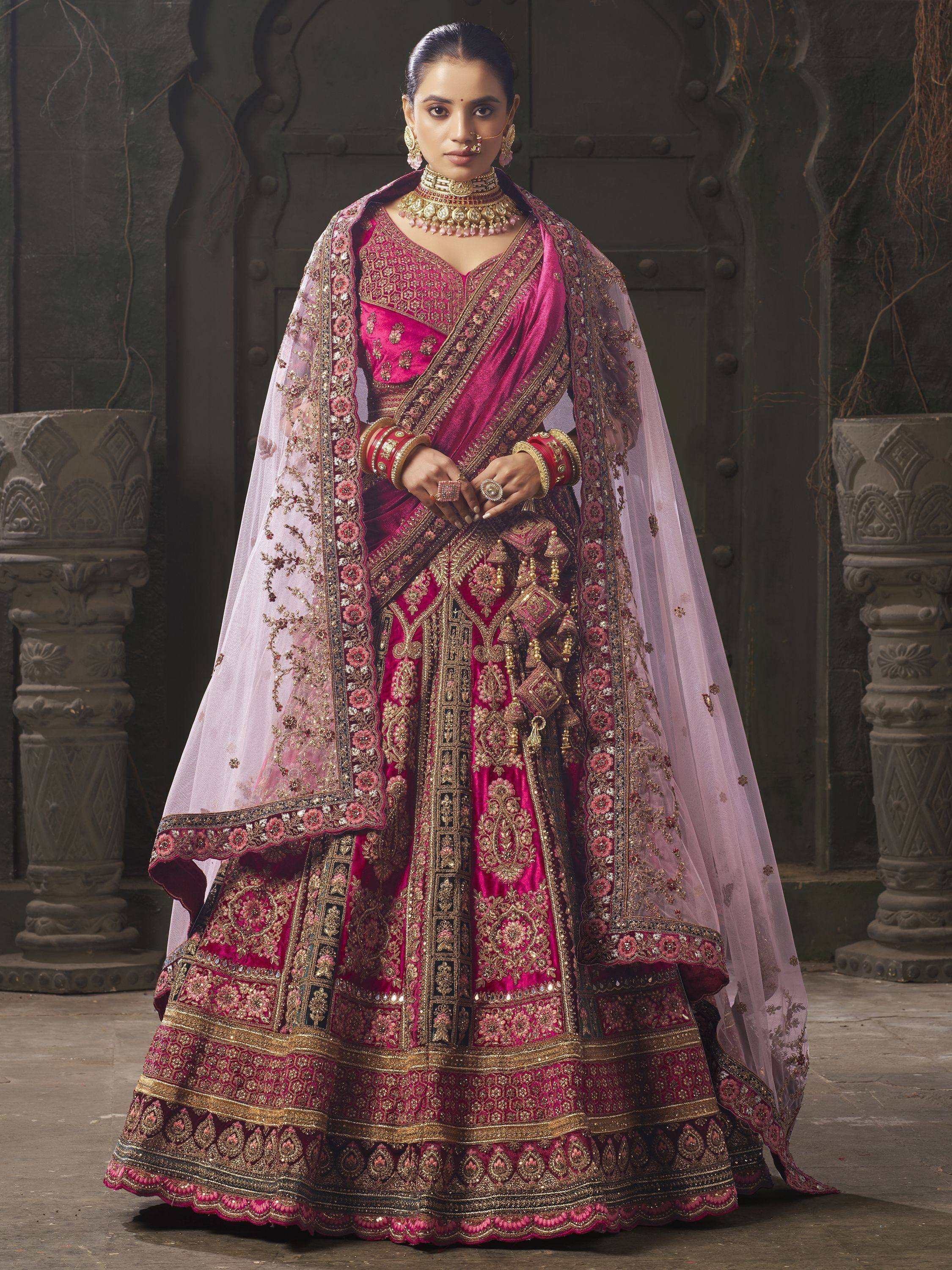 Pink and gold embroidered lehenga choli with sheer dupatta, traditional Indian ethnic wear for weddings