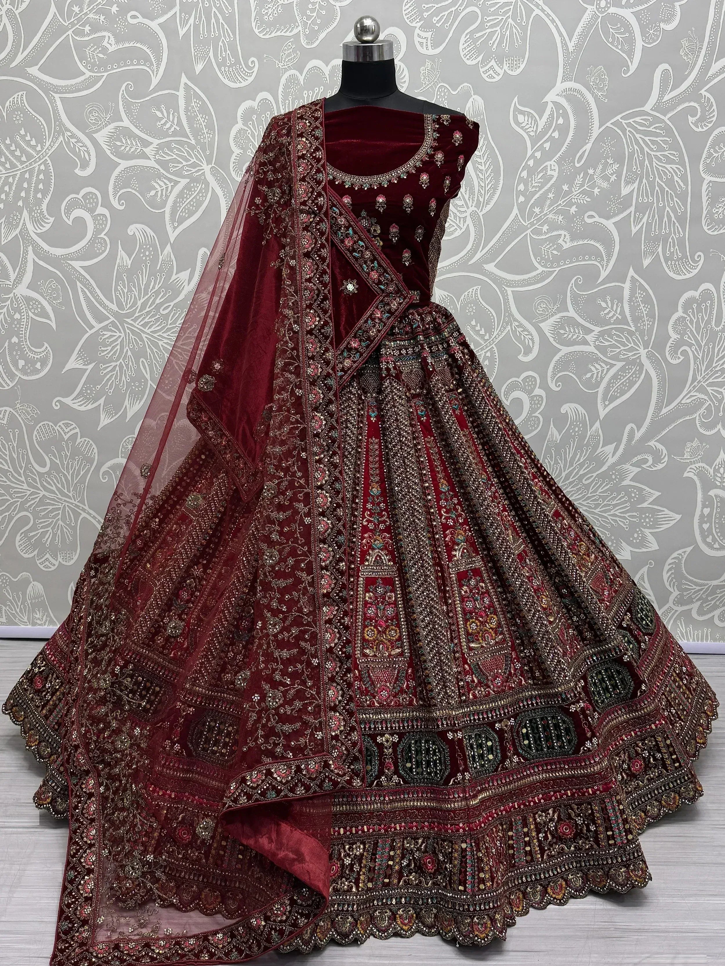 Maroon velvet designer lehenga choli with heavy embroidery and net dupatta, Indian ethnic wear