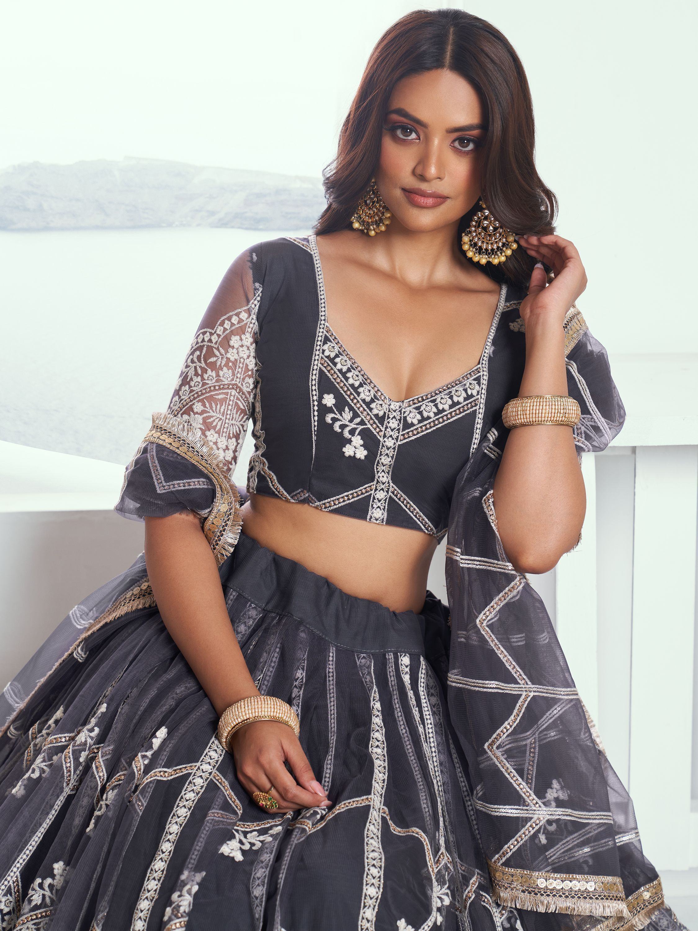 Grey embroidered lehenga choli with sheer sleeves, perfect for Indian ethnic wear occasions