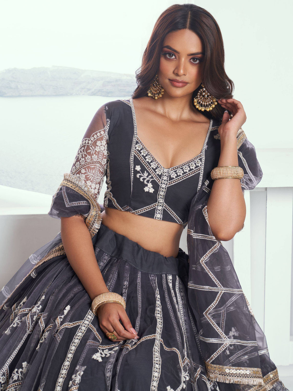Grey embroidered lehenga choli with sheer sleeves, perfect for Indian ethnic wear occasions