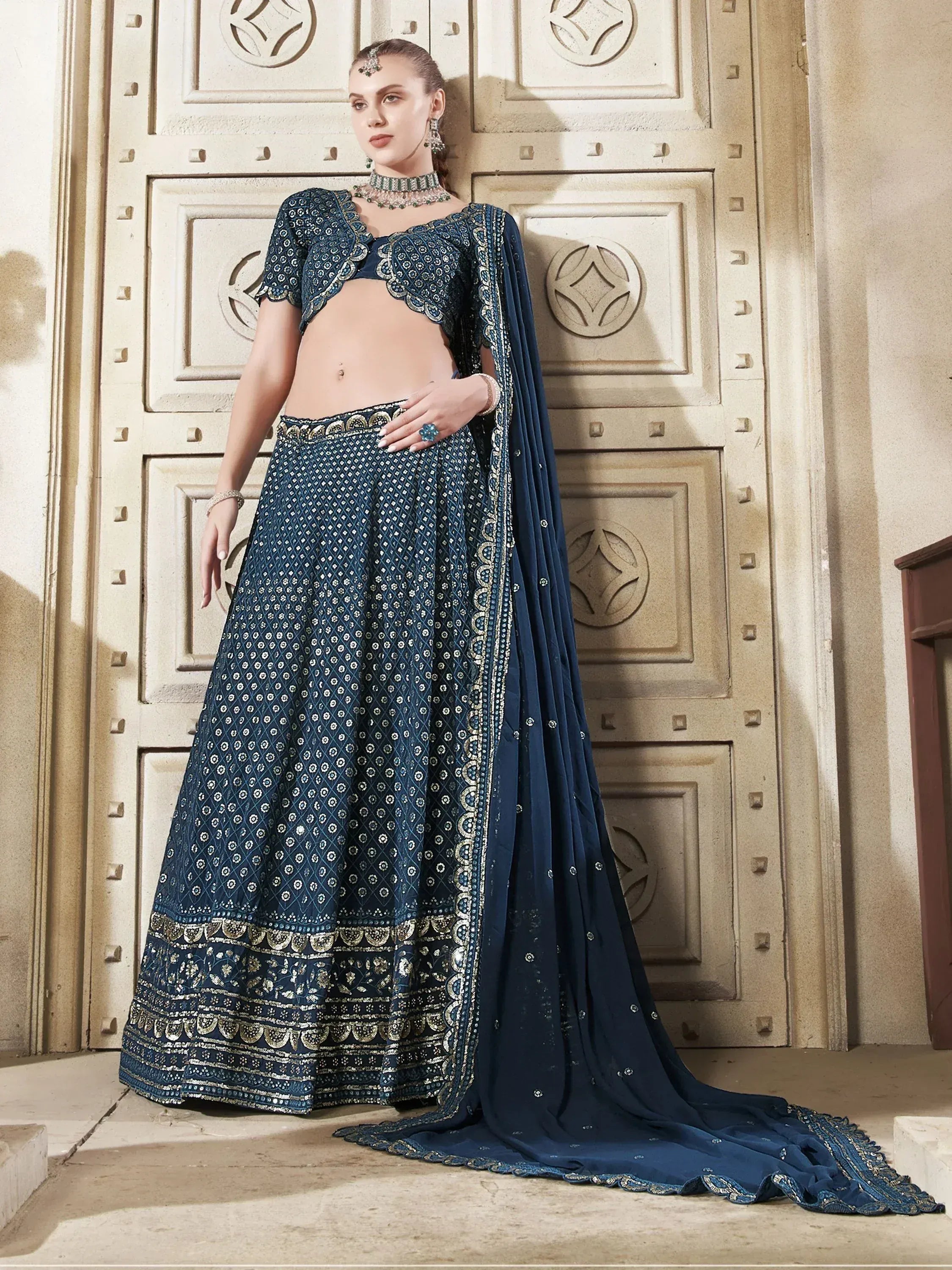 Elegant navy blue lehenga choli with gold embroidery, perfect for Indian ethnic wear and festive occasions.