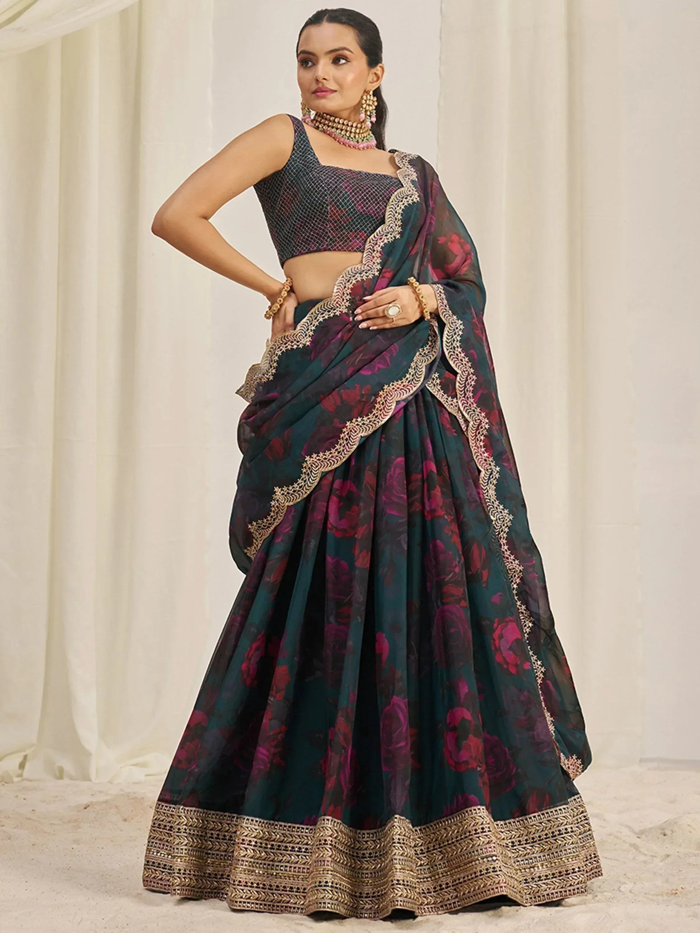 Elegant teal and maroon floral lehenga choli with gold embroidery, perfect for Indian ethnic occasions.