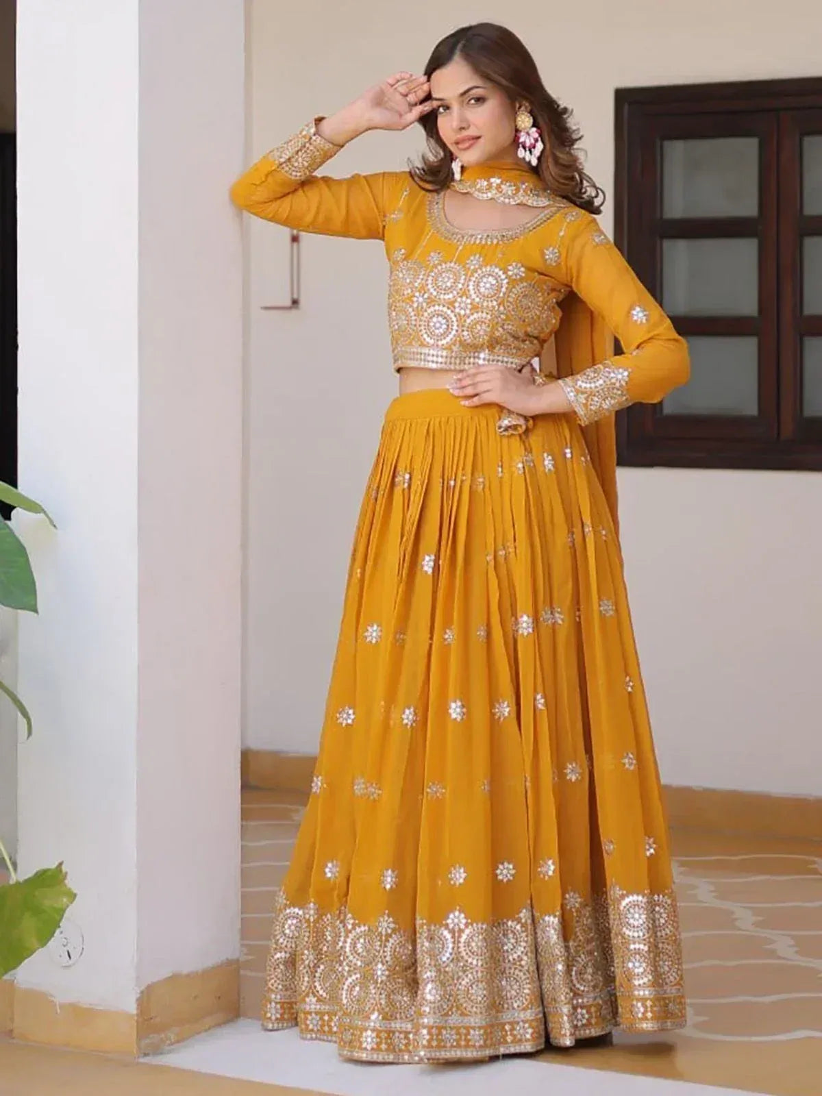 Mustard yellow embroidered lehenga choli with mirror work, perfect for Indian ethnic occasions