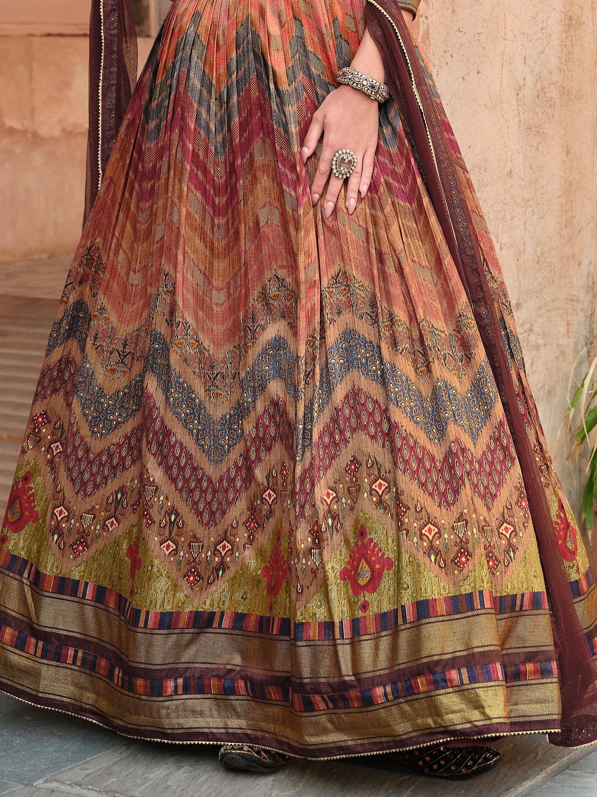Ethnic printed lehenga choli with geometric patterns and traditional jewelry, perfect for Indian celebrations