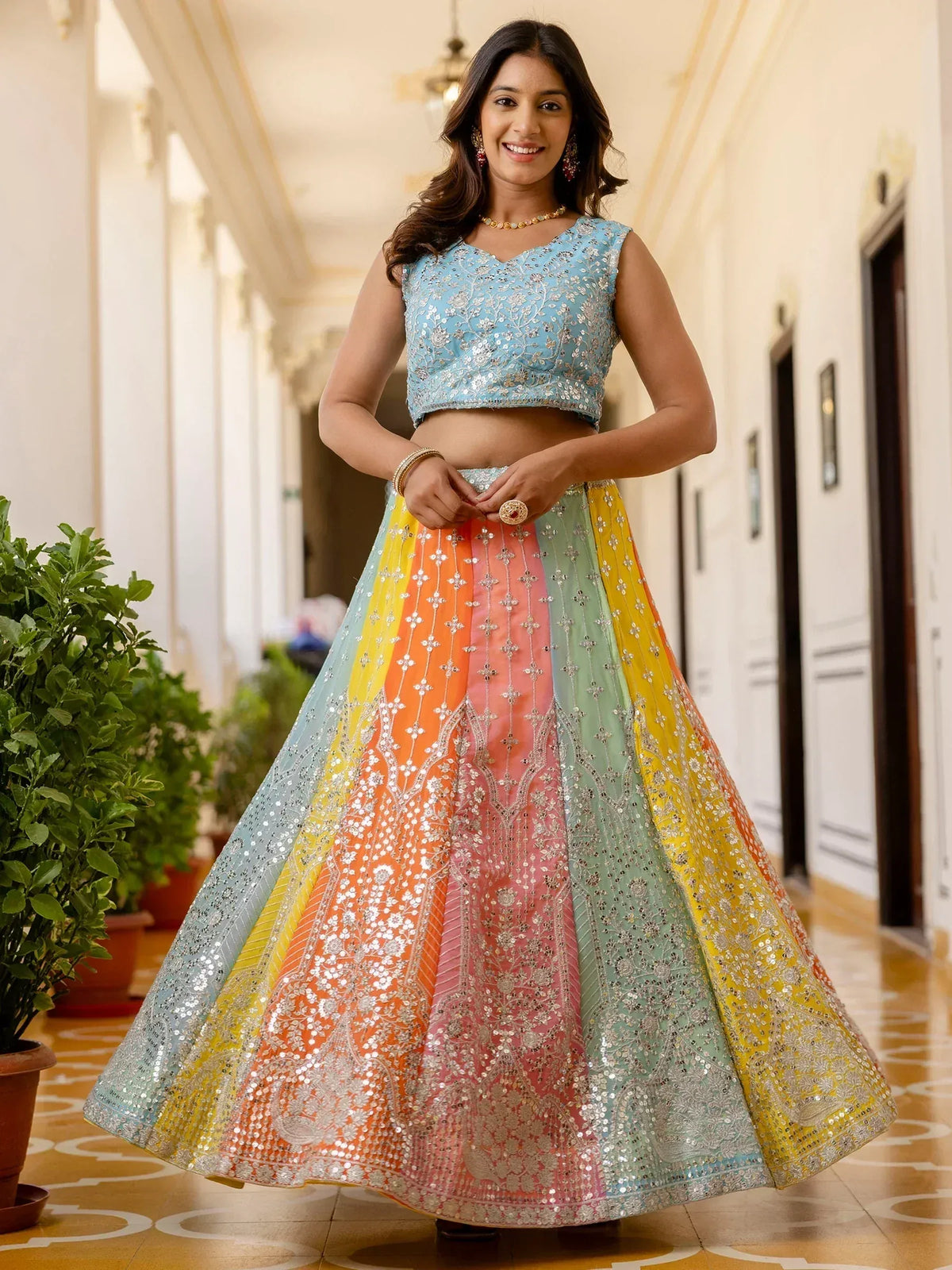 Colorful embroidered lehenga choli with pastel top and rainbow skirt, perfect for Indian ethnic occasions