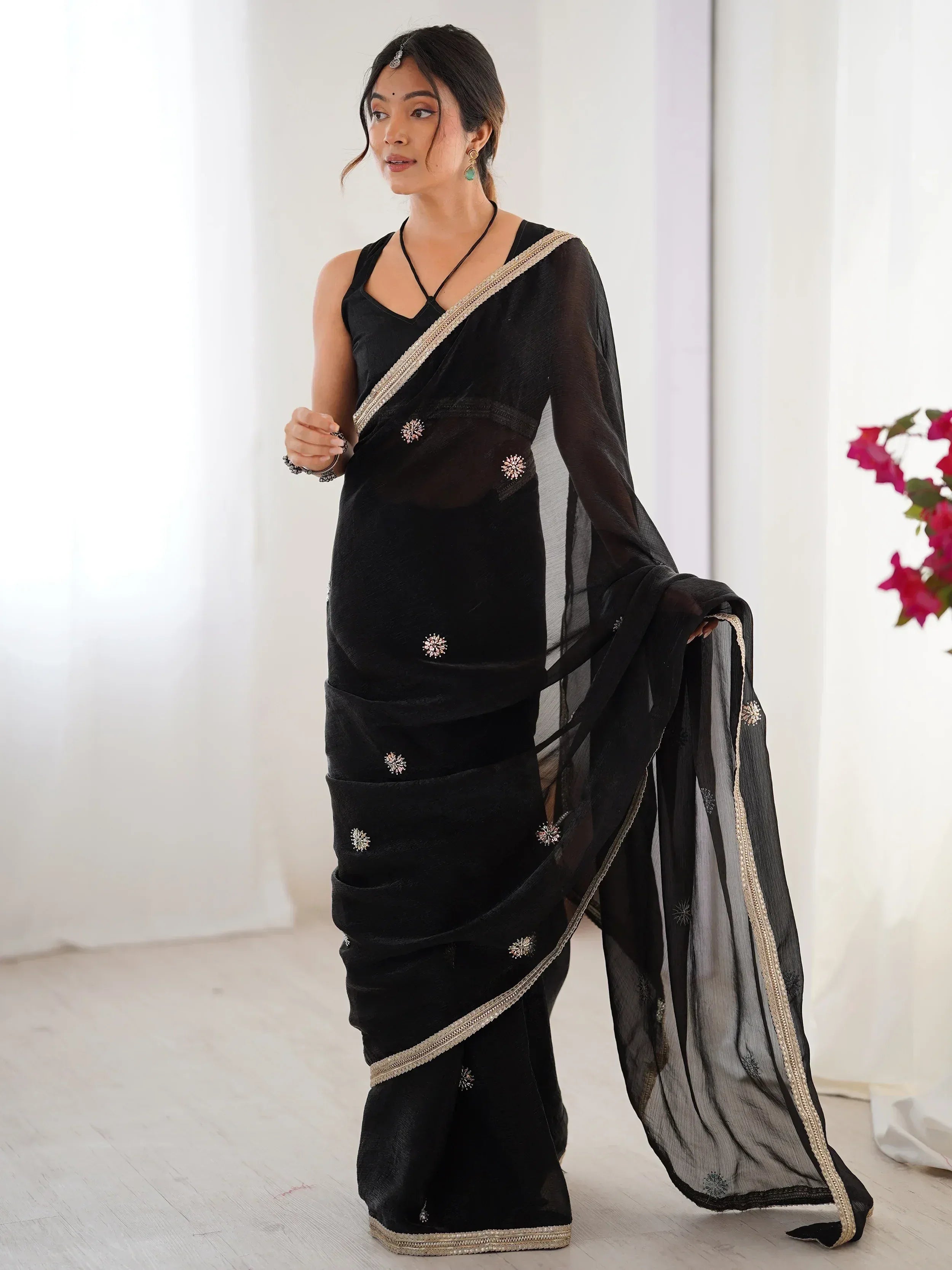 Black embroidered saree with gold border, stylish Indian ethnic wear for women