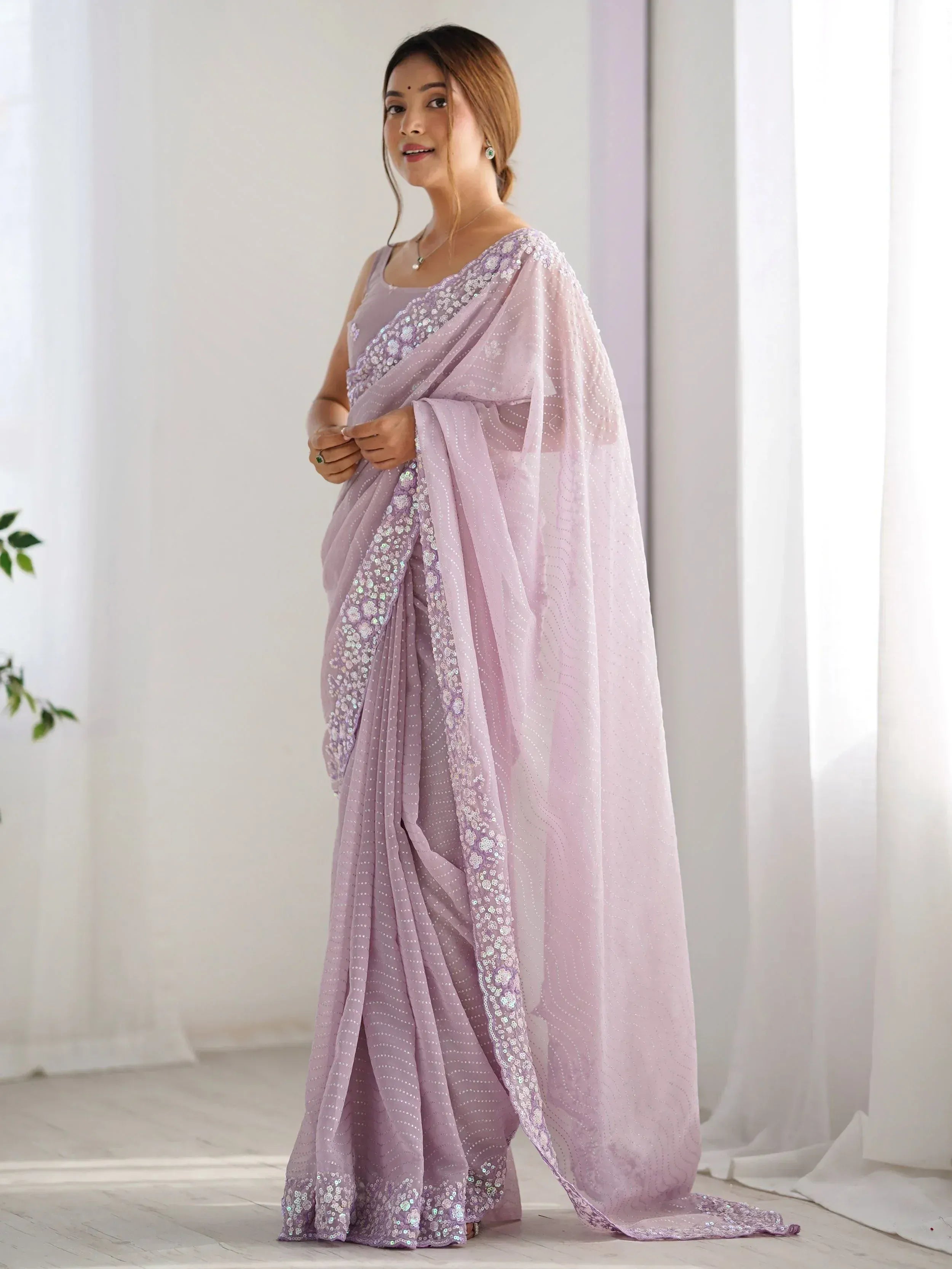 Lavender sequin saree with floral embroidery, perfect for Indian ethnic occasions and festive wear.