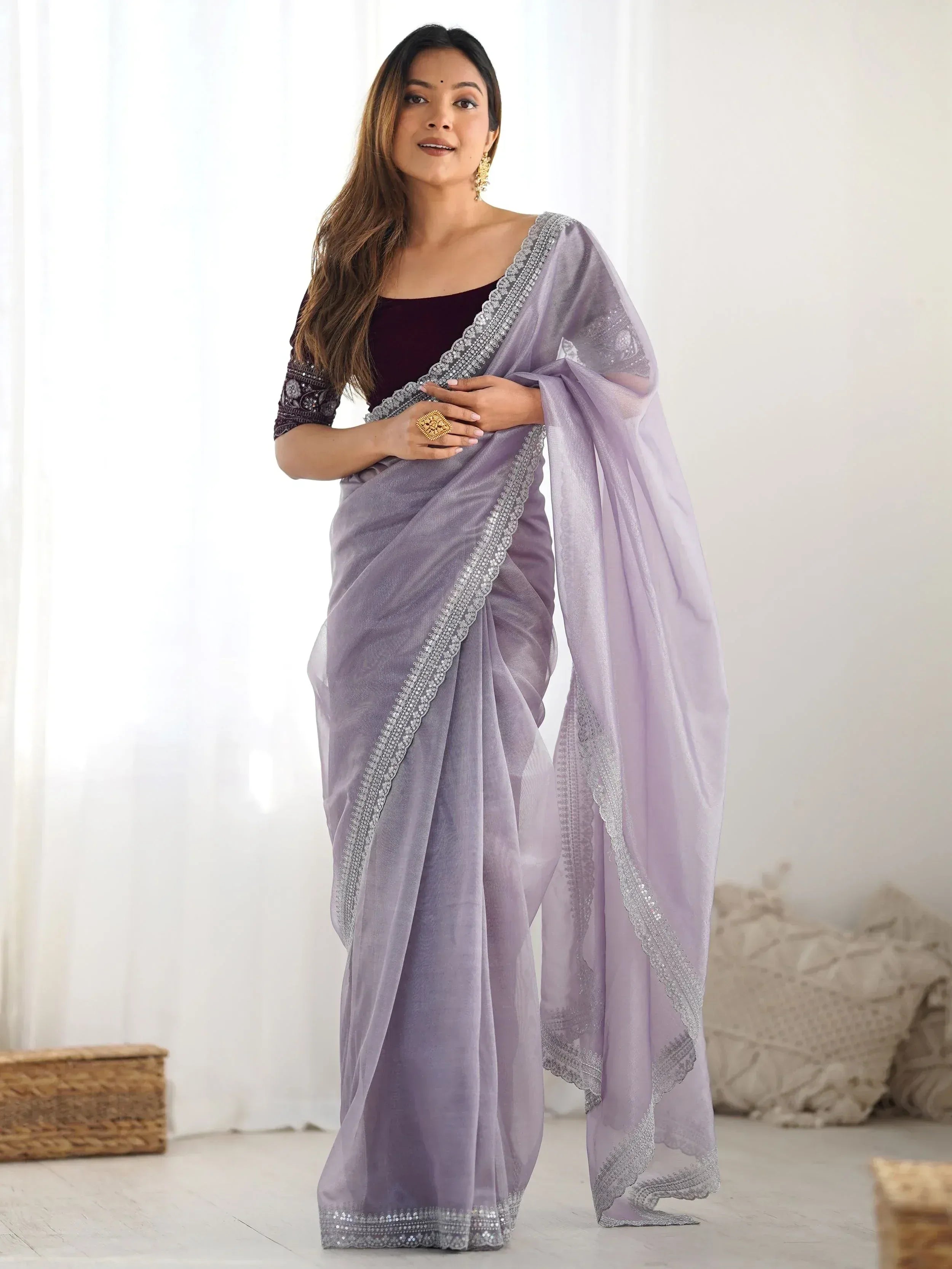 Lavender saree with silver embroidery, paired with maroon blouse, elegant Indian ethnic wear