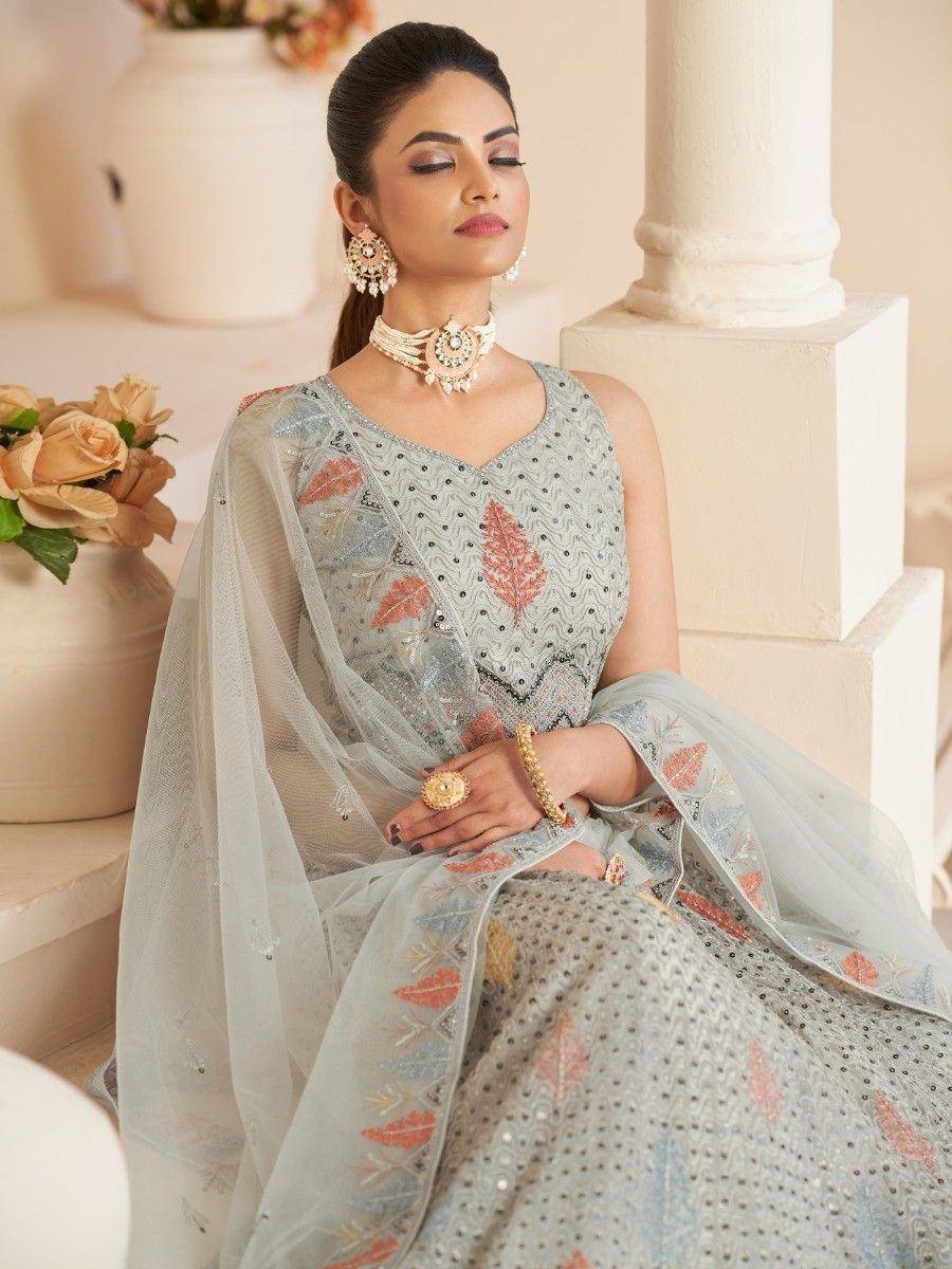 Elegant grey embroidered lehenga choli with leaf motifs, perfect for Indian ethnic wear occasions