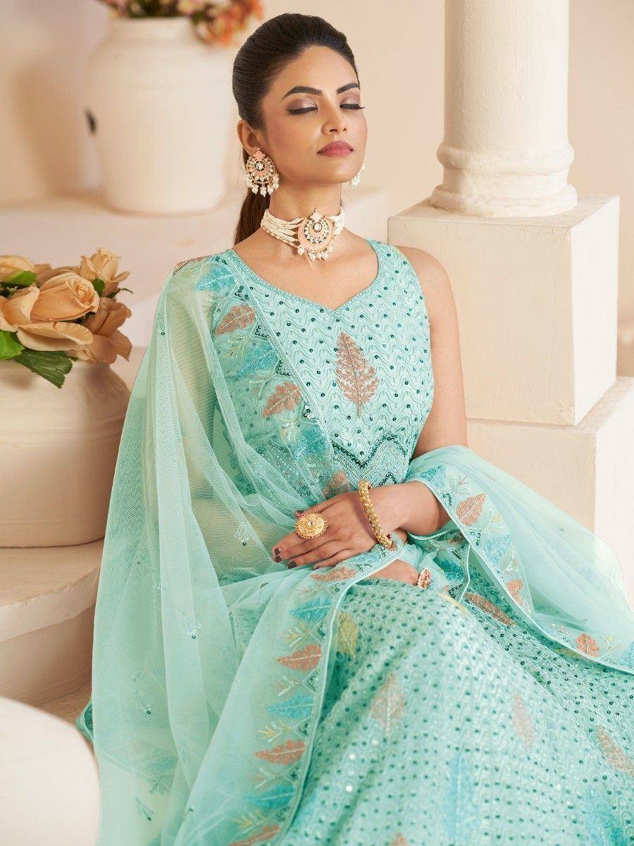 Mint green embroidered lehenga choli with leaf motifs, perfect for Indian ethnic wear occasions