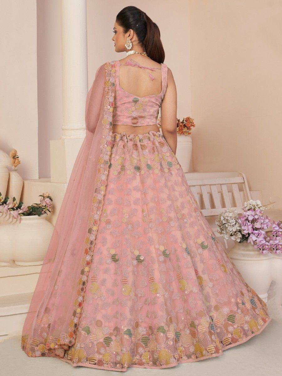 Pink embroidered lehenga choli with floral motifs, perfect for Indian ethnic wear occasions