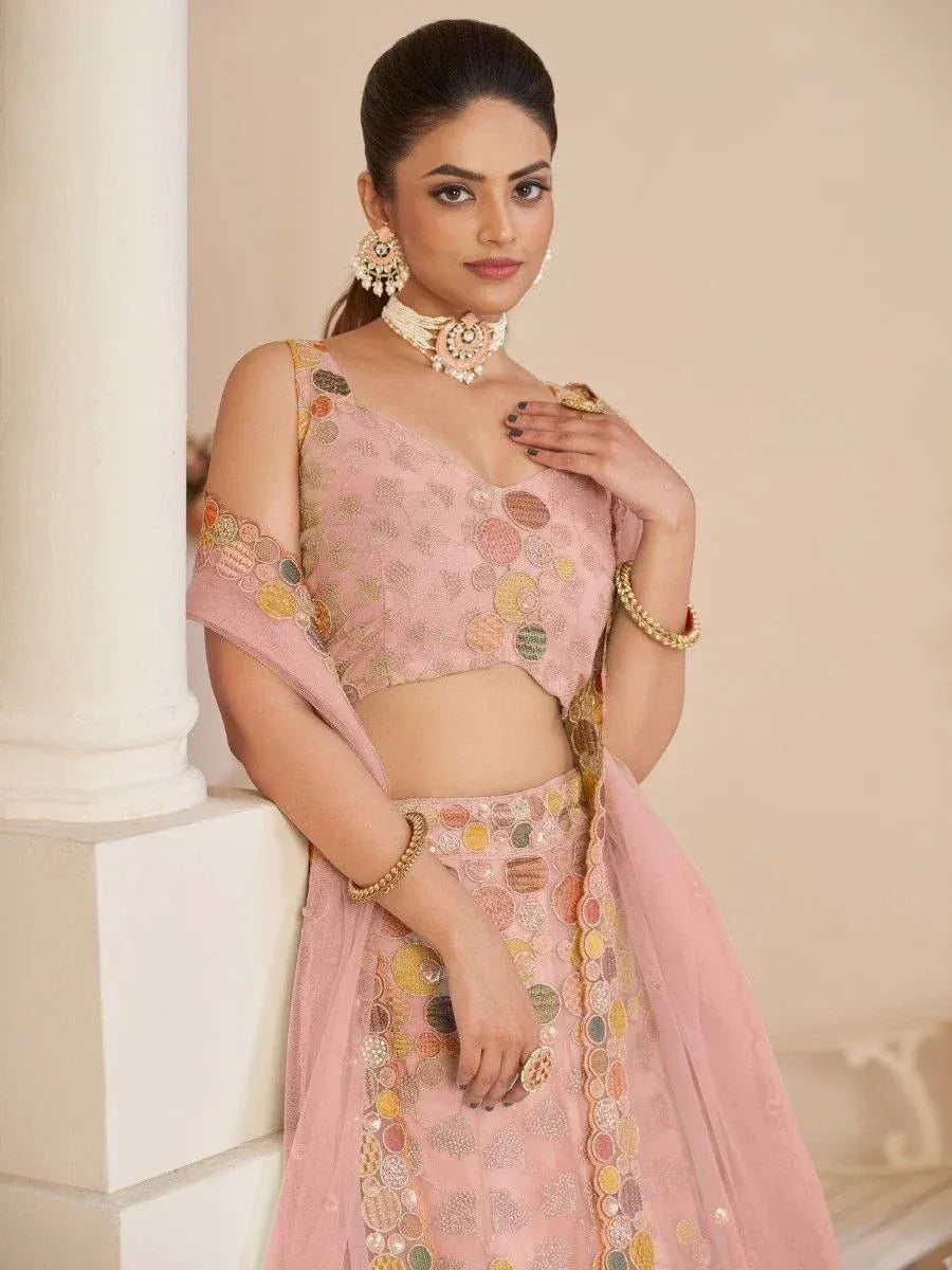 Pink embroidered lehenga choli with circular motifs, perfect for Indian ethnic wear and festive occasions