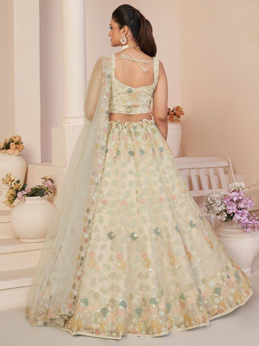 Elegant pastel lehenga choli with floral embroidery and sheer dupatta, perfect for Indian ethnic occasions