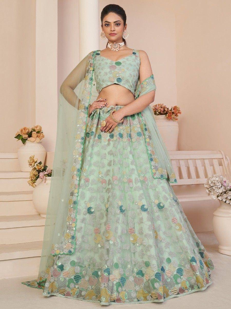 Mint green designer lehenga choli with colorful sequin embroidery, perfect for Indian ethnic occasions.
