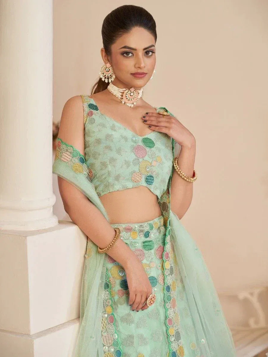 Mint green designer lehenga choli with colorful circular embroidery, perfect for Indian ethnic occasions