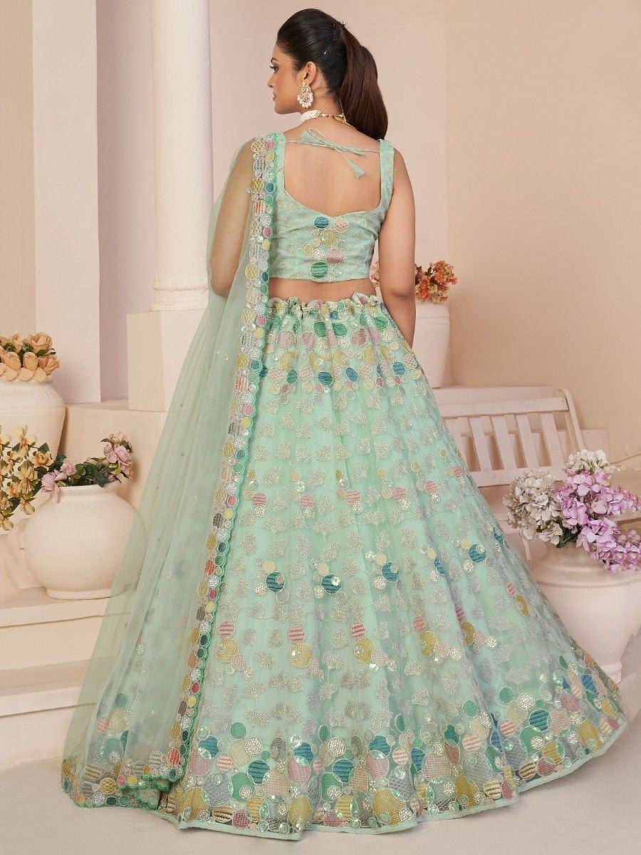 Mint green designer lehenga choli with colorful sequin embroidery, perfect for Indian ethnic wear events.