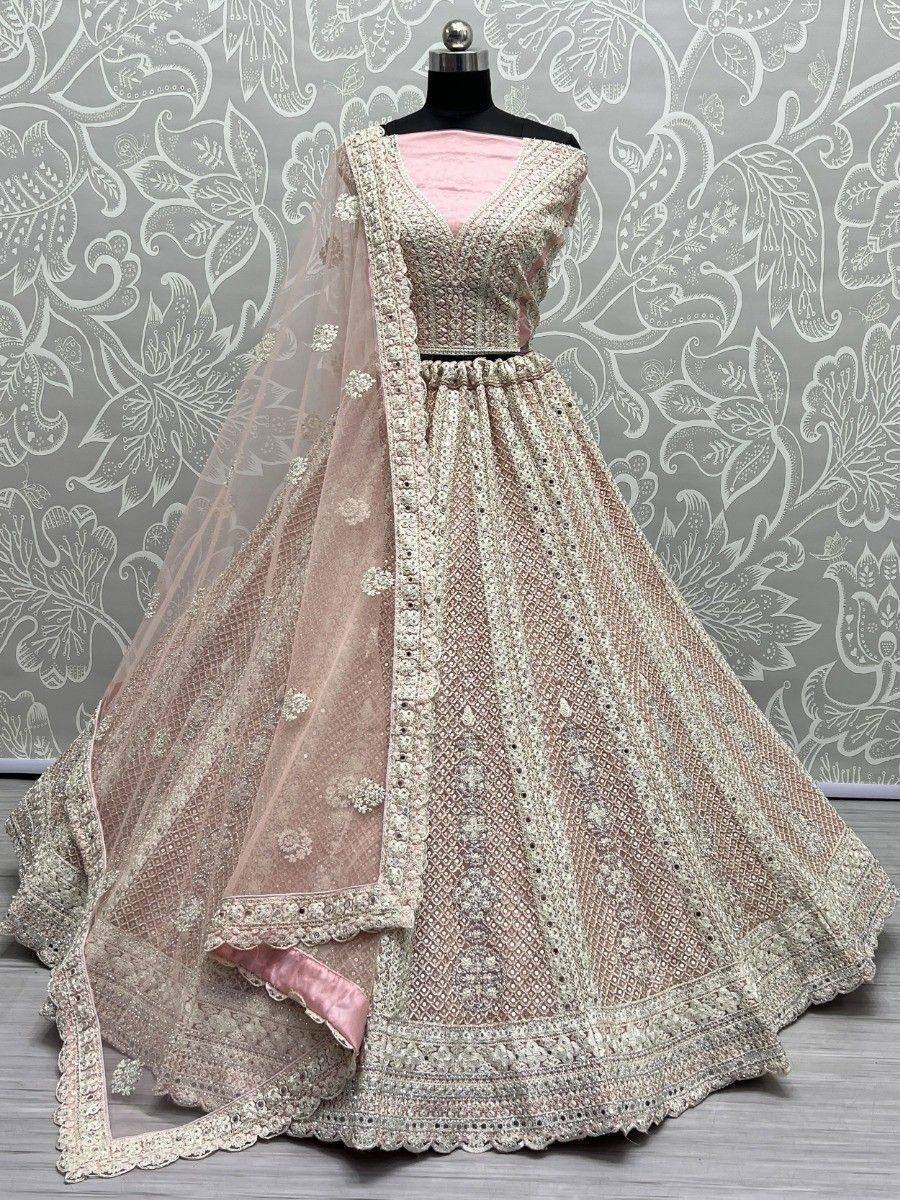 Pink and beige embroidered lehenga choli with net dupatta, perfect for Indian weddings and festive occasions