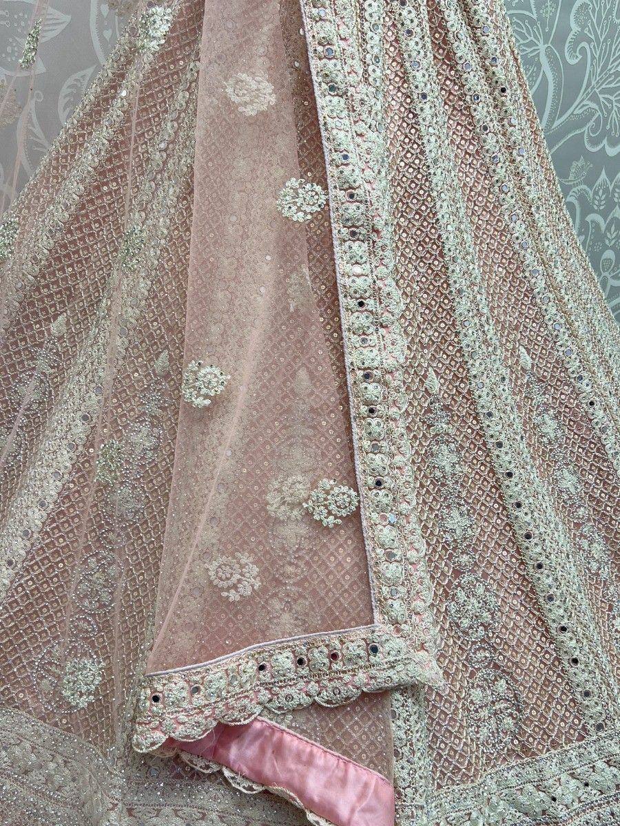 Pink embroidered lehenga choli with floral motifs and scalloped border, Indian ethnic wear