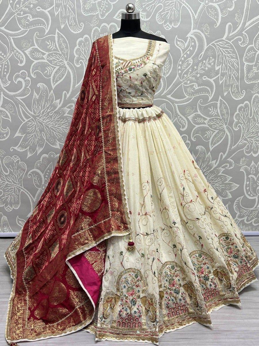 Elegant cream lehenga choli with red dupatta, floral embroidery, and gold detailing for ethnic occasions