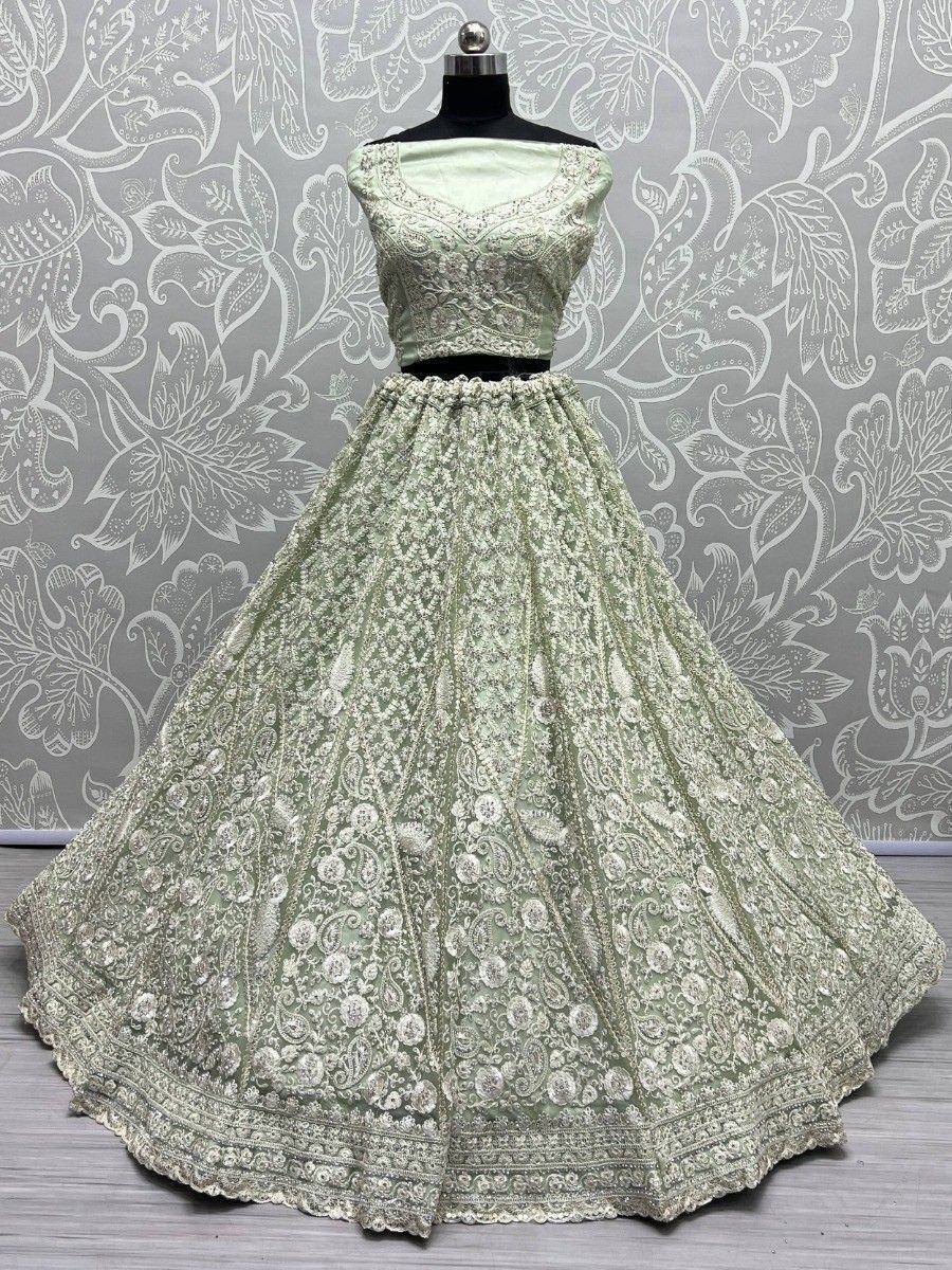 Mint green designer lehenga choli with intricate embroidery and flared skirt for Indian ethnic wear