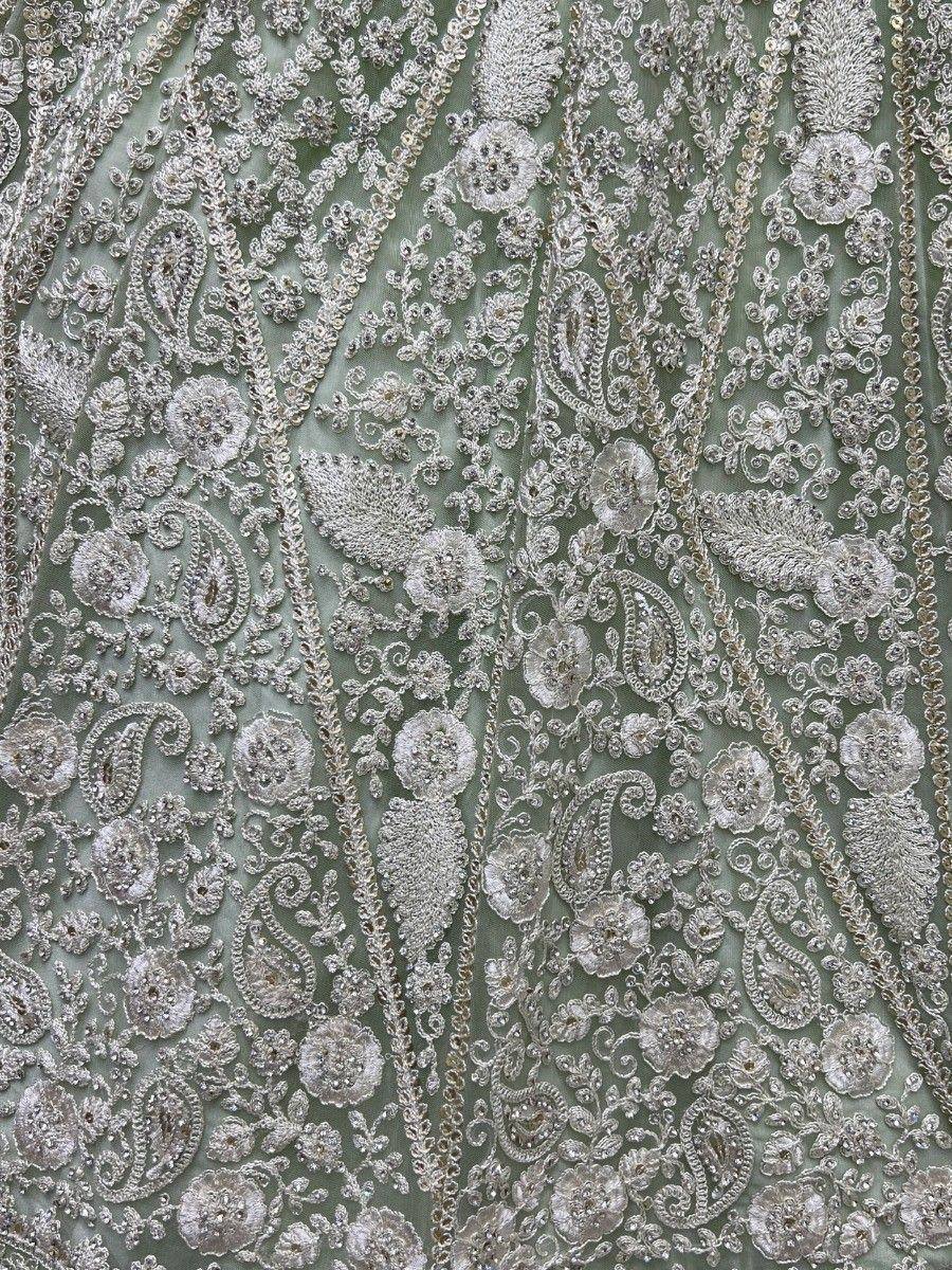 Silver floral and paisley embroidery on sage green fabric, ideal for designer lehenga or ethnic gown