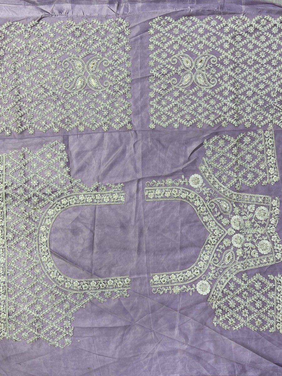 Lavender ethnic blouse fabric with intricate light green floral embroidery and paisley motifs for designer wear