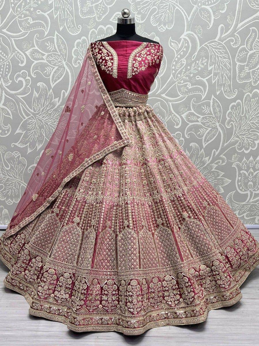 Maroon and gold embroidered lehenga choli with net dupatta, perfect for Indian weddings and festive occasions.