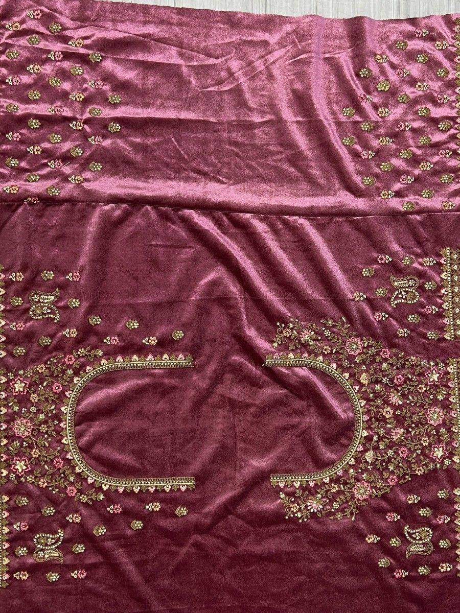 Maroon velvet ethnic gown with gold and pink floral embroidery, perfect for Indian celebrations