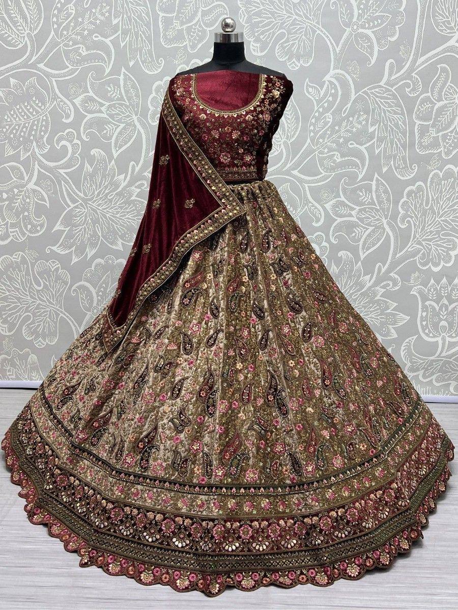 Maroon and gold embroidered lehenga choli with floral paisley design, perfect for Indian weddings and festivals.