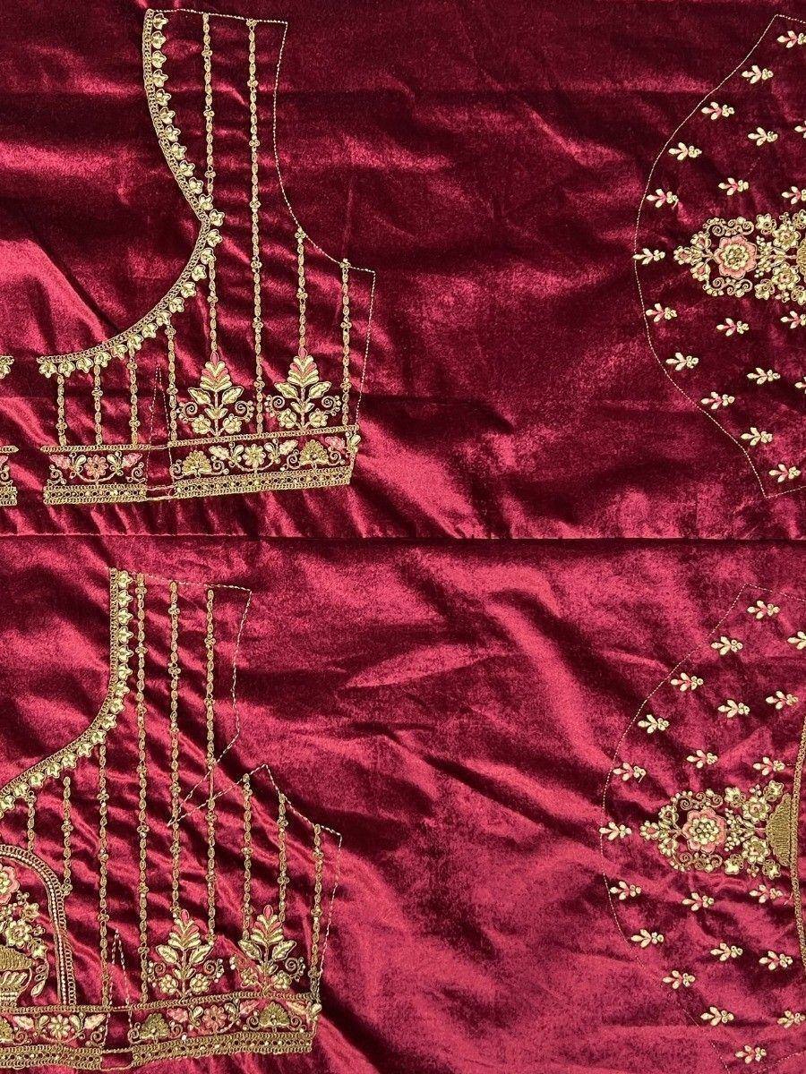 Rich maroon velvet lehenga choli with gold floral embroidery and intricate detailing