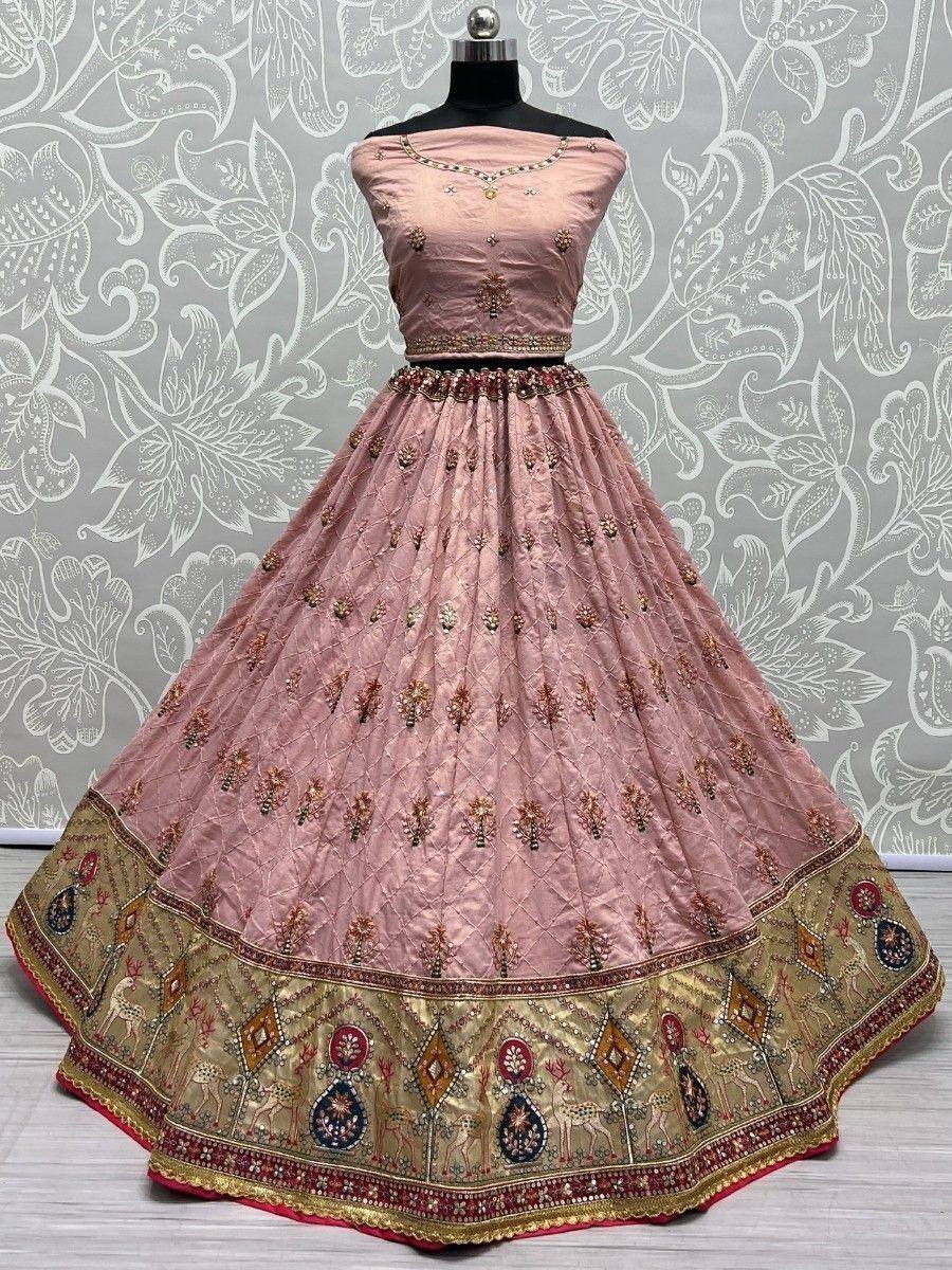 Pink embroidered lehenga choli with gold border, perfect for Indian weddings and festive occasions