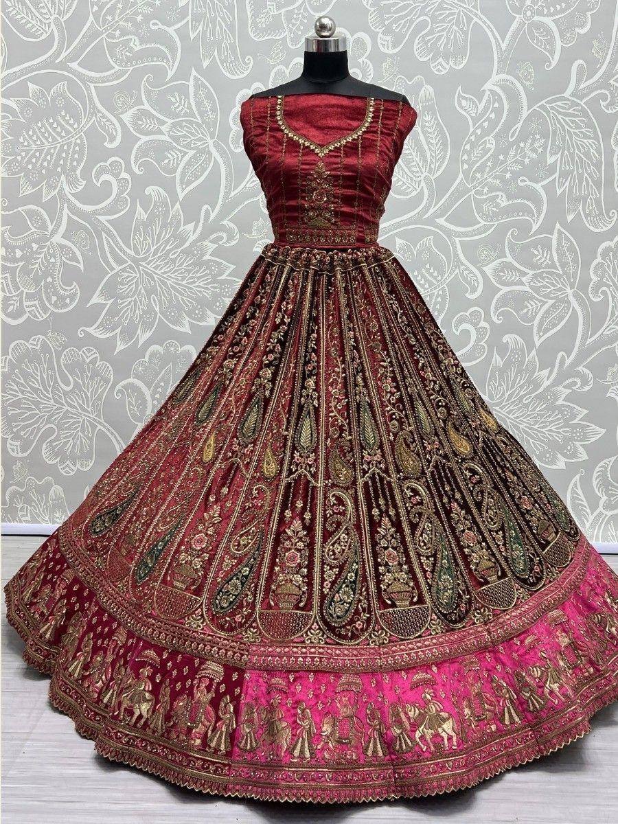 Red and pink embroidered lehenga choli with gold paisley and floral motifs, perfect for Indian weddings.