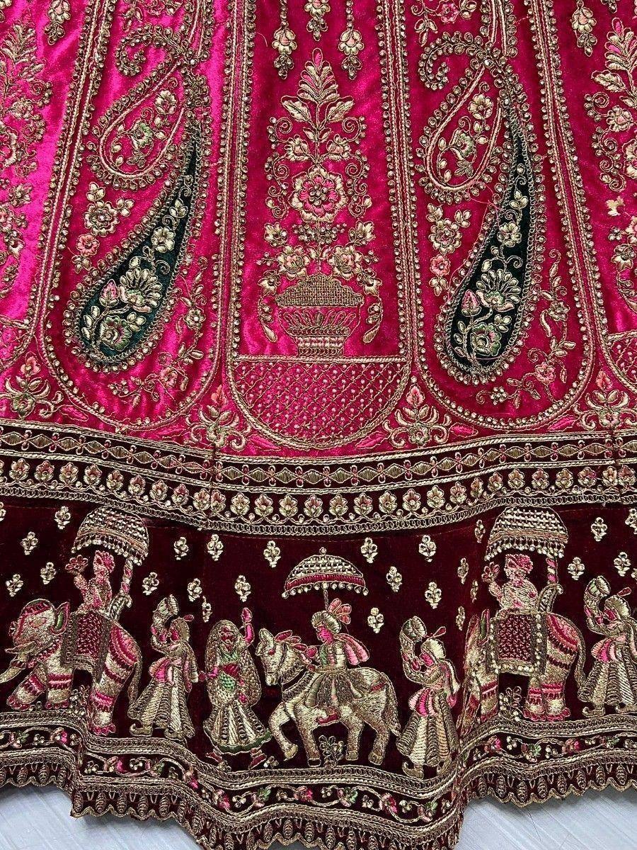 Pink velvet lehenga with gold embroidery, elephant & horse motifs, traditional Indian bridal wear