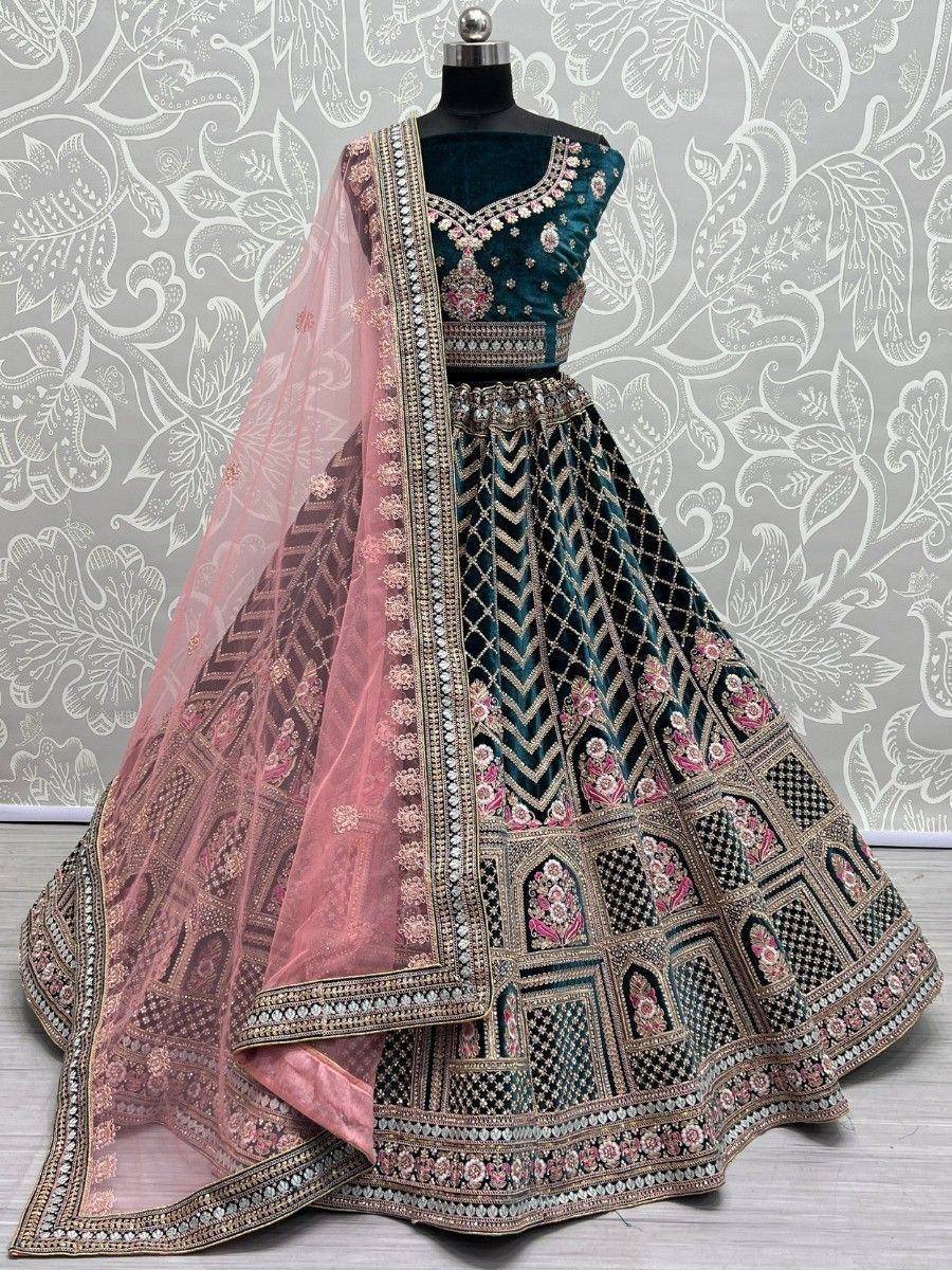 Teal velvet lehenga choli with pink dupatta, intricate embroidery, perfect for Indian weddings and festive occasions.