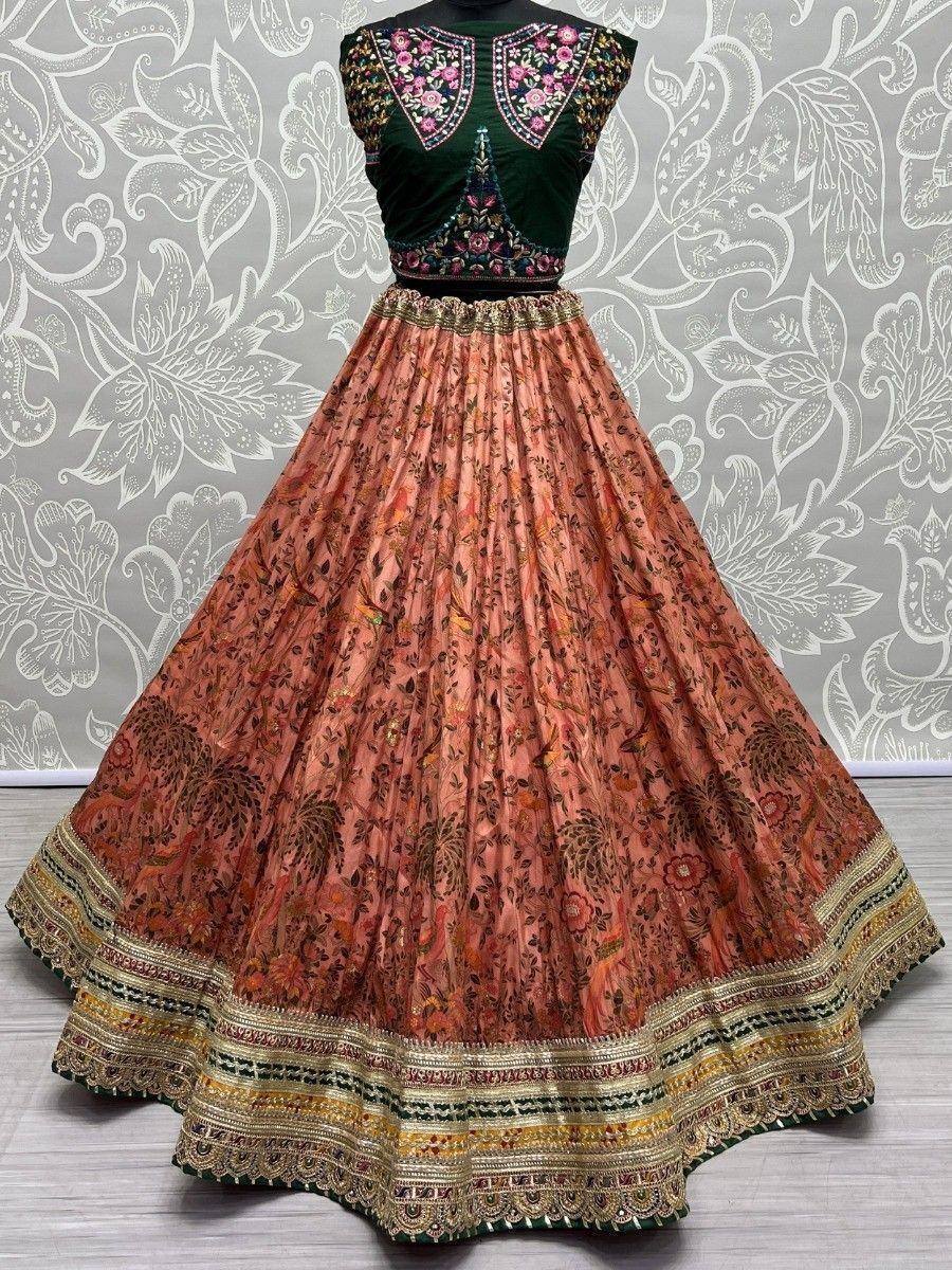 Emerald green embroidered blouse with peach floral lehenga, perfect for Indian ethnic wear occasions