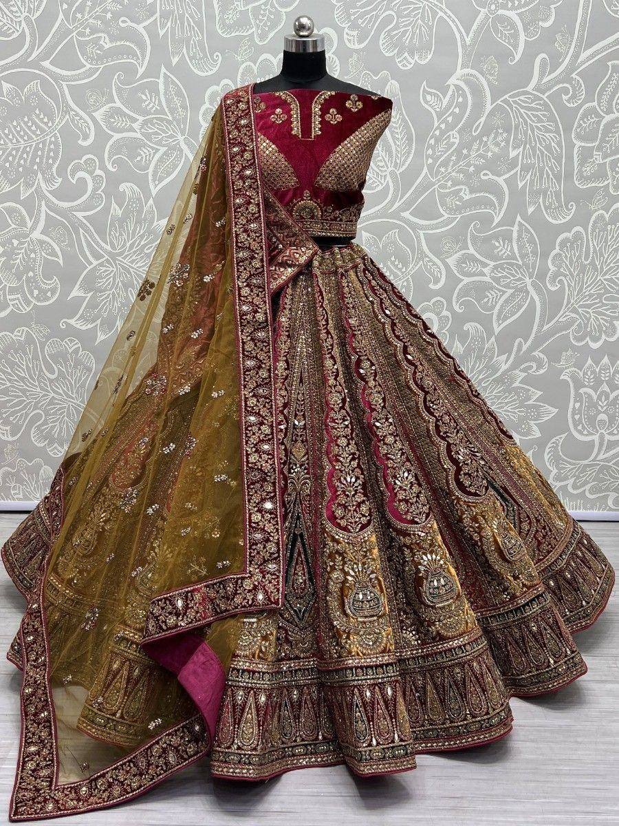 Maroon and gold designer lehenga choli with heavy embroidery and sheer dupatta, perfect for Indian weddings
