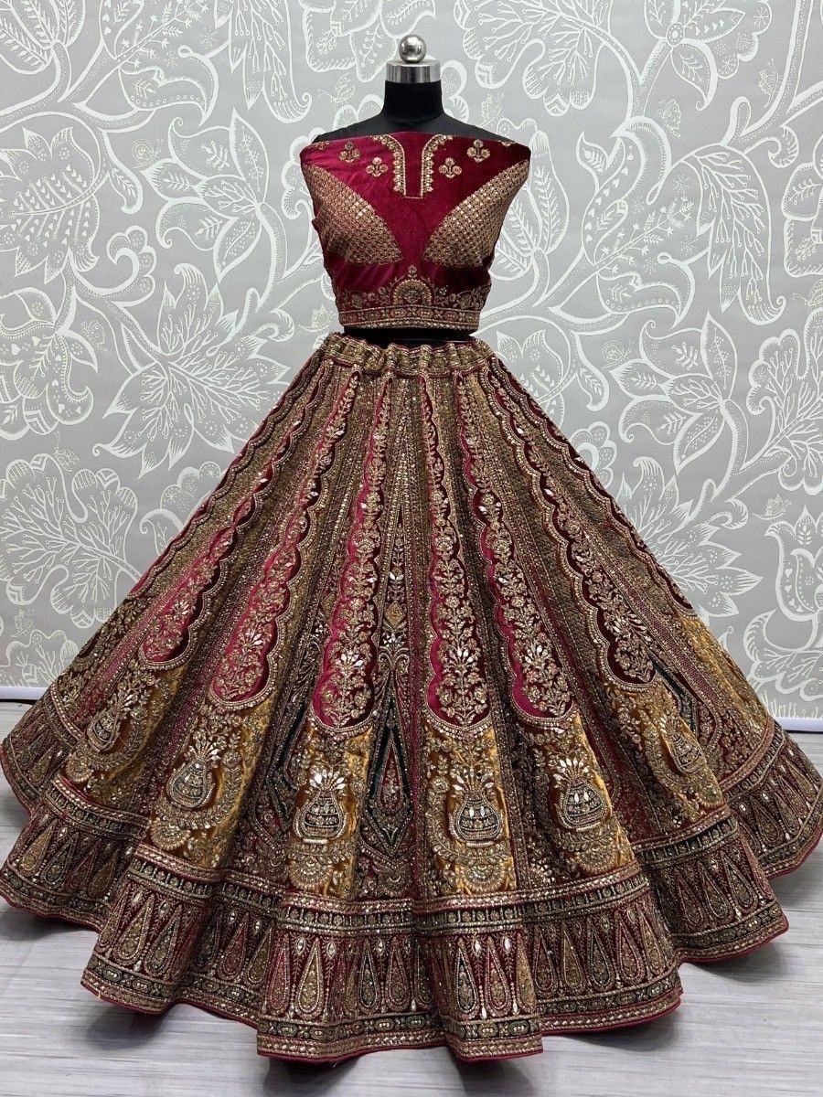 Maroon and gold designer lehenga choli with heavy embroidery, perfect for Indian weddings and festive occasions.