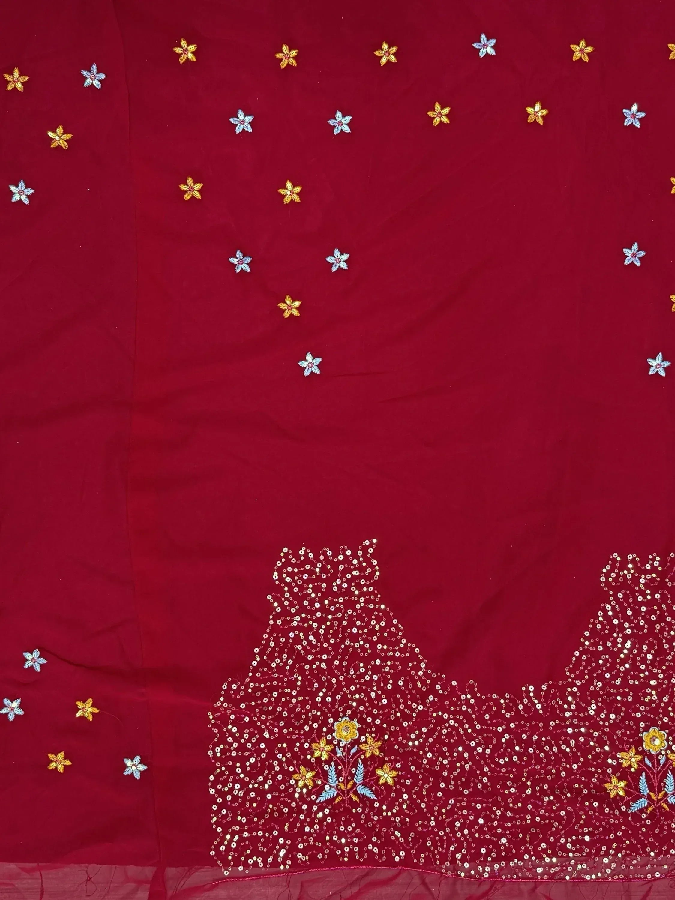Red ethnic saree with floral embroidery and sequin border, ideal for Indian weddings and festive occasions.