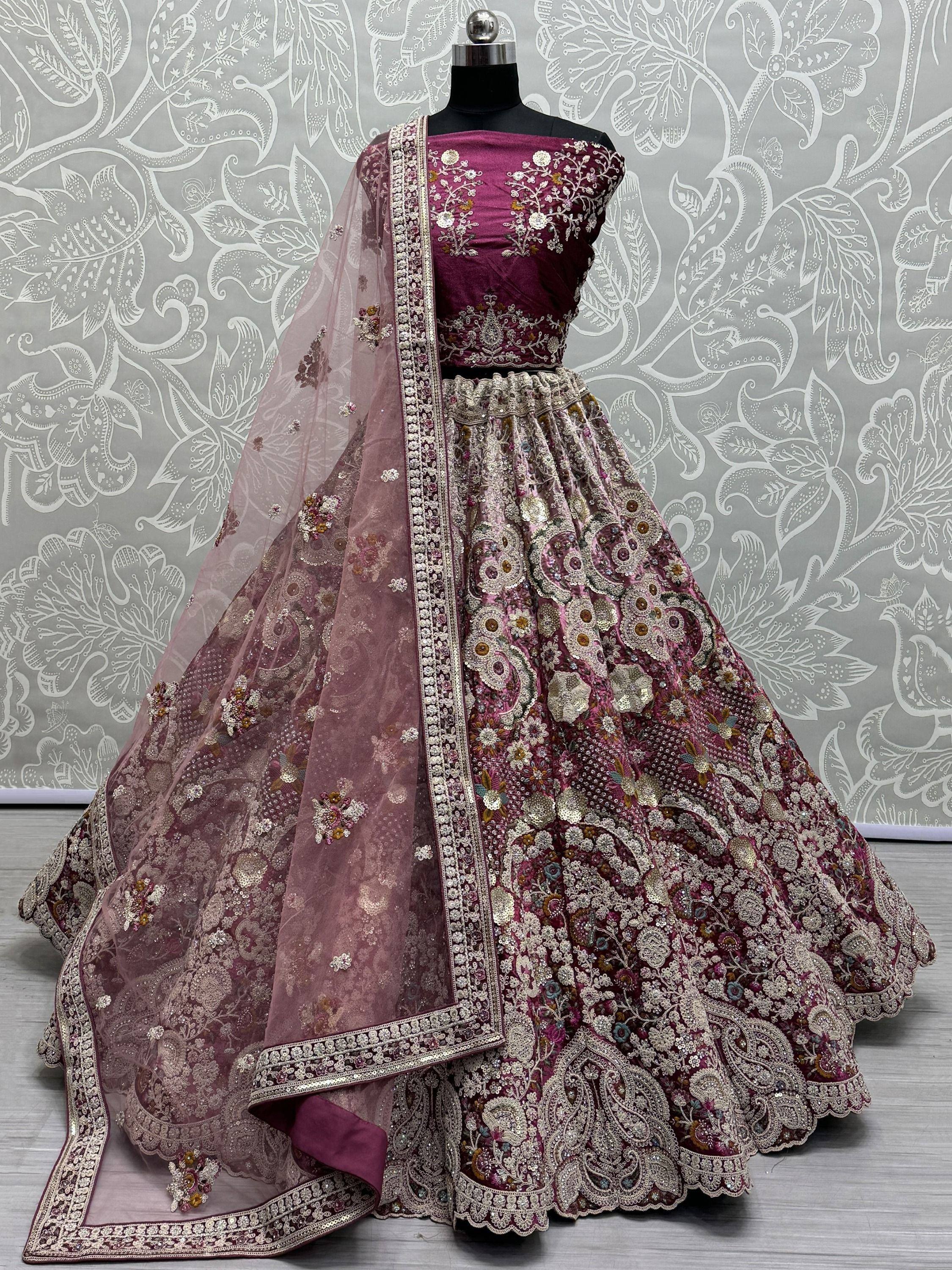 Elegant maroon lehenga choli with heavy floral embroidery and matching dupatta, perfect for Indian weddings.