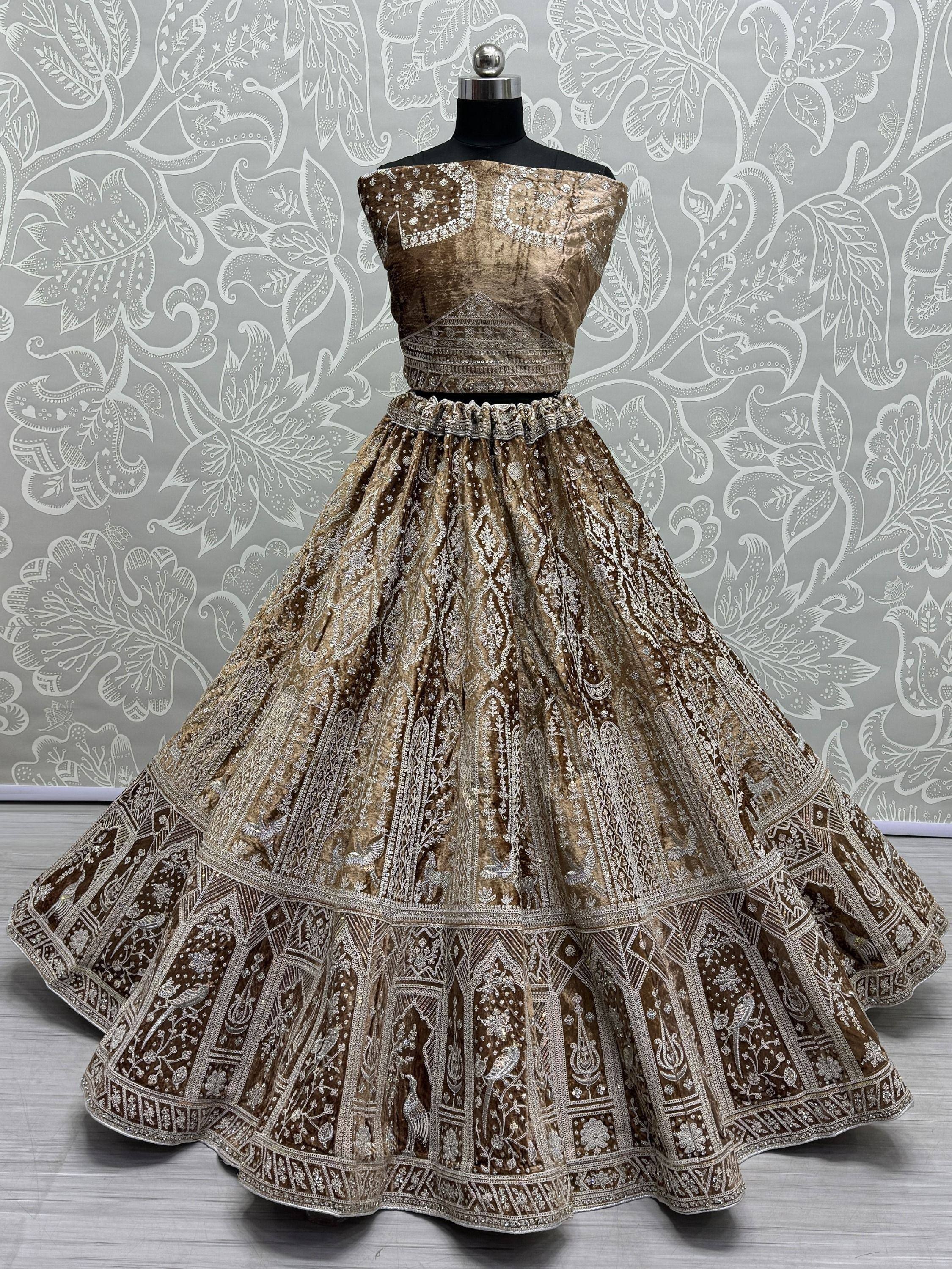 Elegant brown velvet lehenga choli with intricate silver embroidery, perfect for Indian ethnic wear occasions.