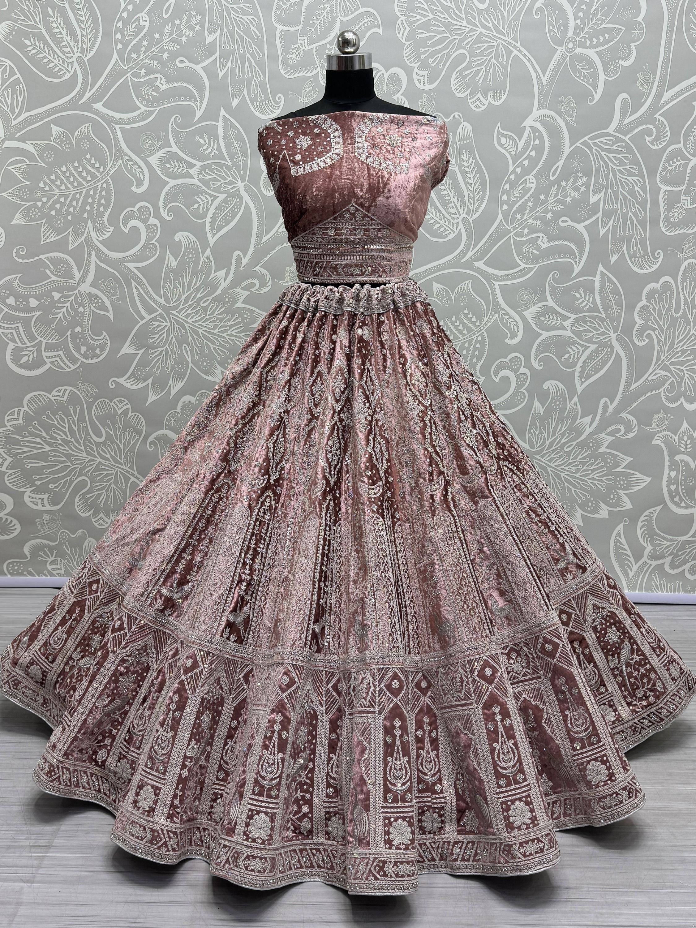 Dusty rose velvet lehenga choli with intricate silver embroidery and embellished skirt for Indian ethnic wear
