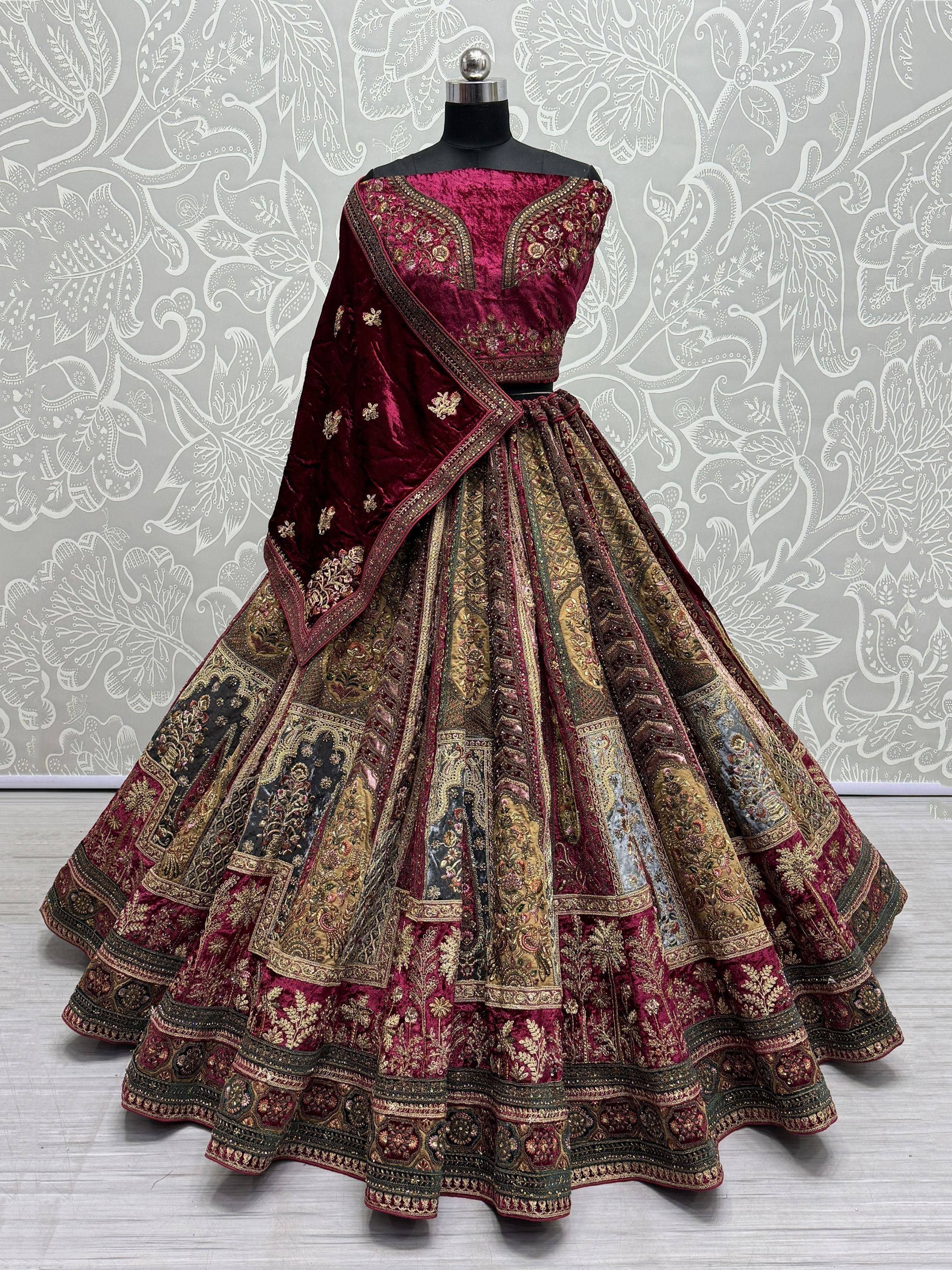 Luxury maroon velvet lehenga choli with heavy gold embroidery and patchwork skirt, perfect for Indian weddings
