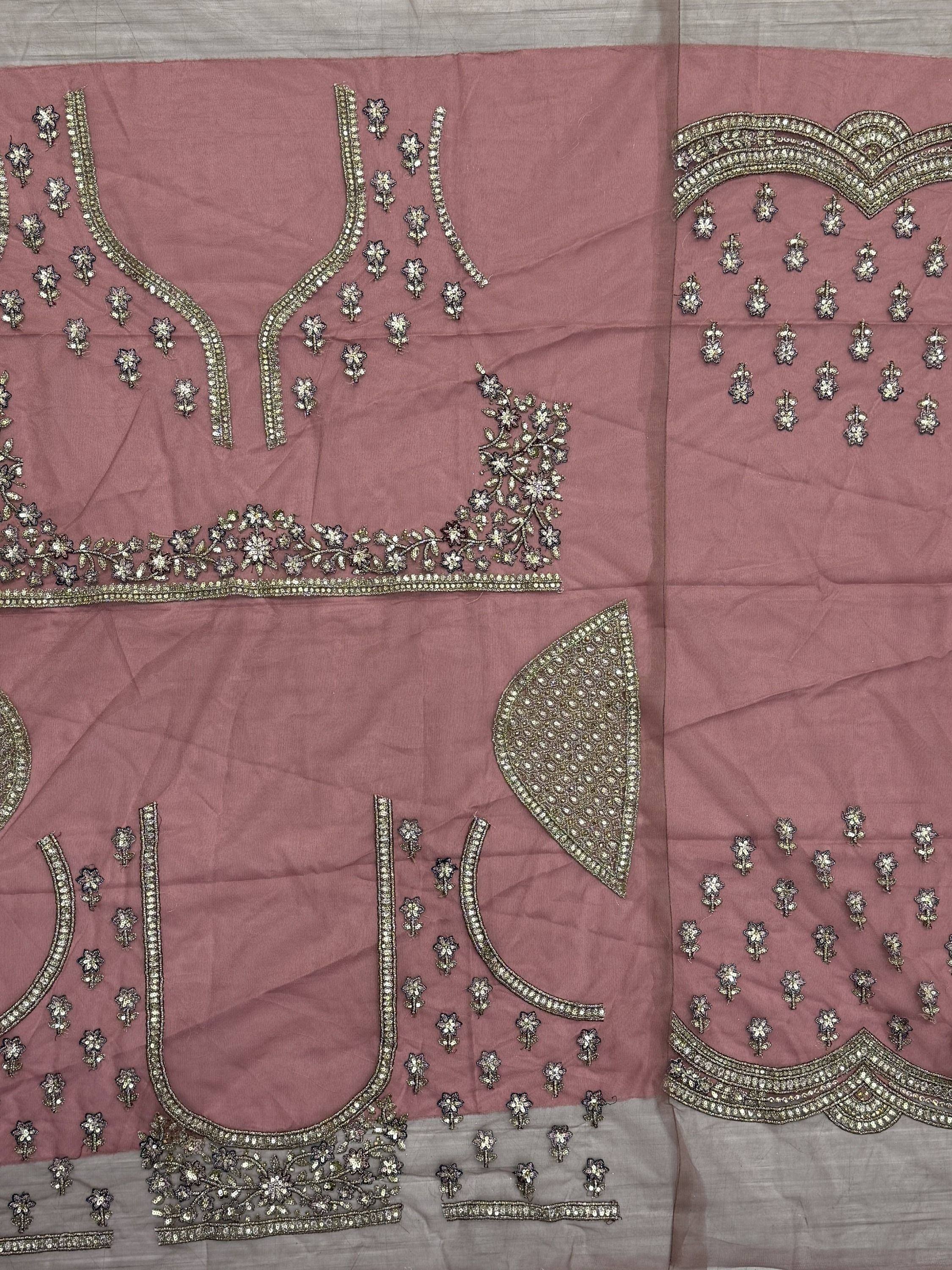 Dusty pink ethnic wear fabric with gold floral embroidery and embellished borders for designer lehenga or saree